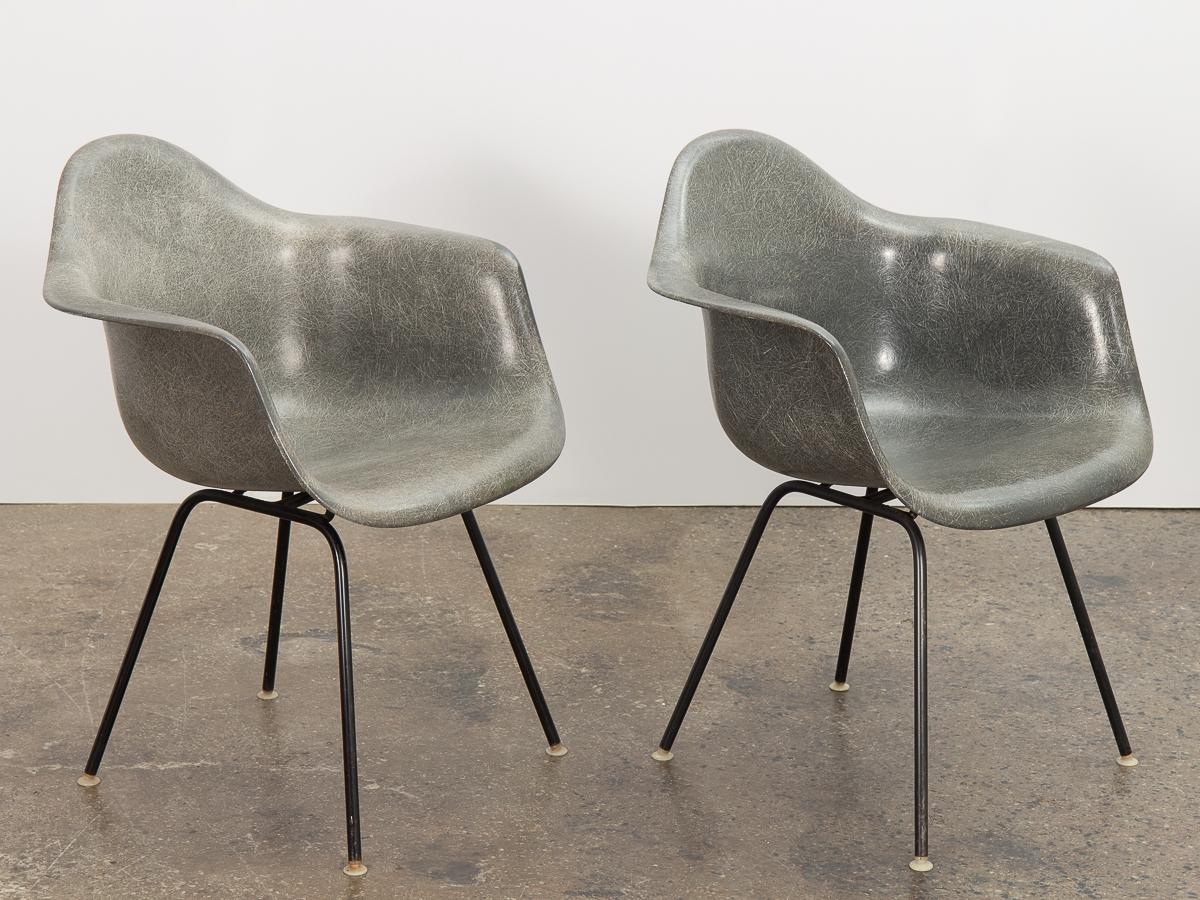 Pair of original elephant hide fiberglass armchairs, designed by Ray and Charles Eames, manufactured by Herman Miller. An early 1950s version, each has a distinct thread texture that varies in saturation and density throughout the molded fiberglass