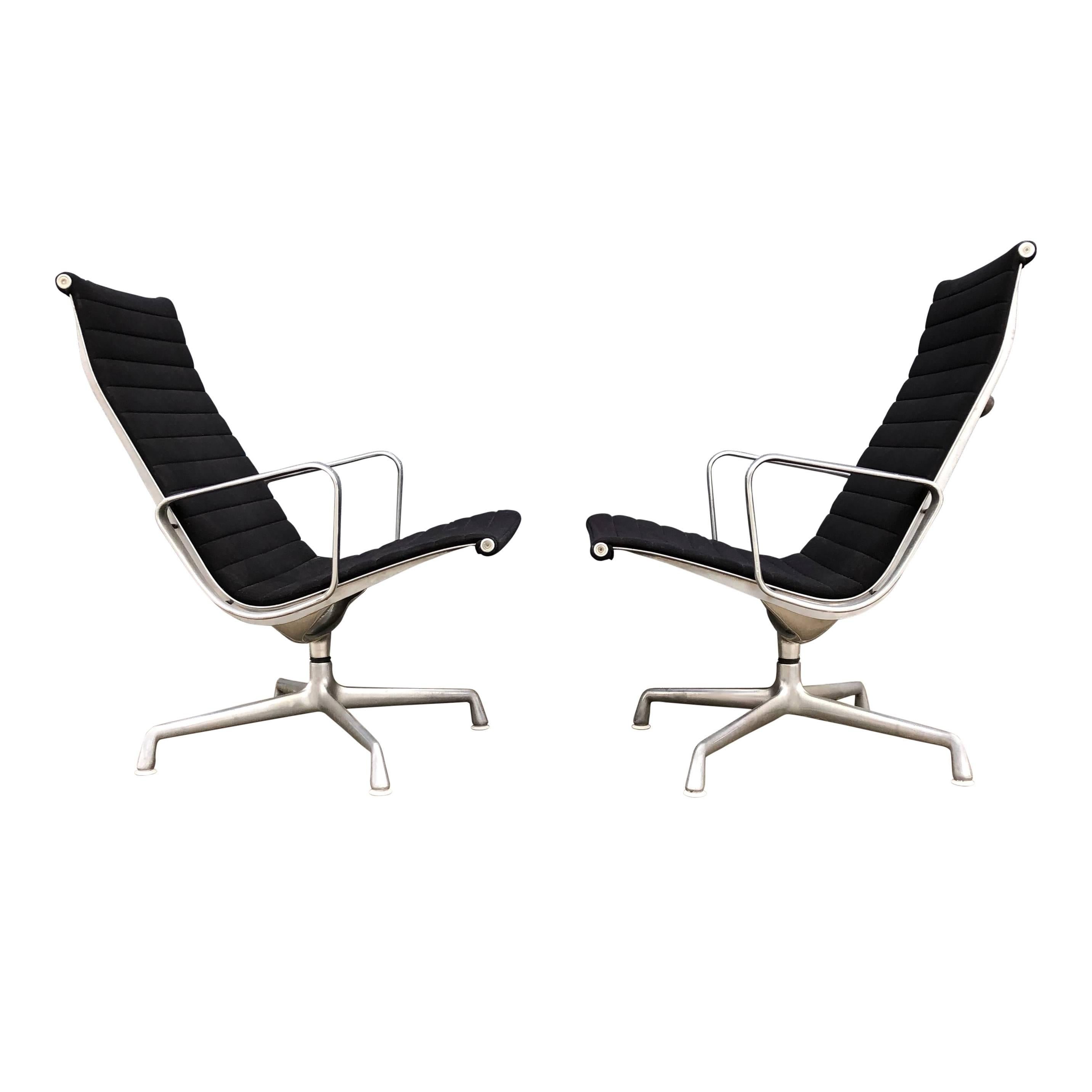 For your consideration are an original pair of Eames for Herman Miller aluminium group lounge chairs. Classics of Mid-Century Modern design.

Original black fabric upholstery is in nice vintage condition, though does show slight signs of
