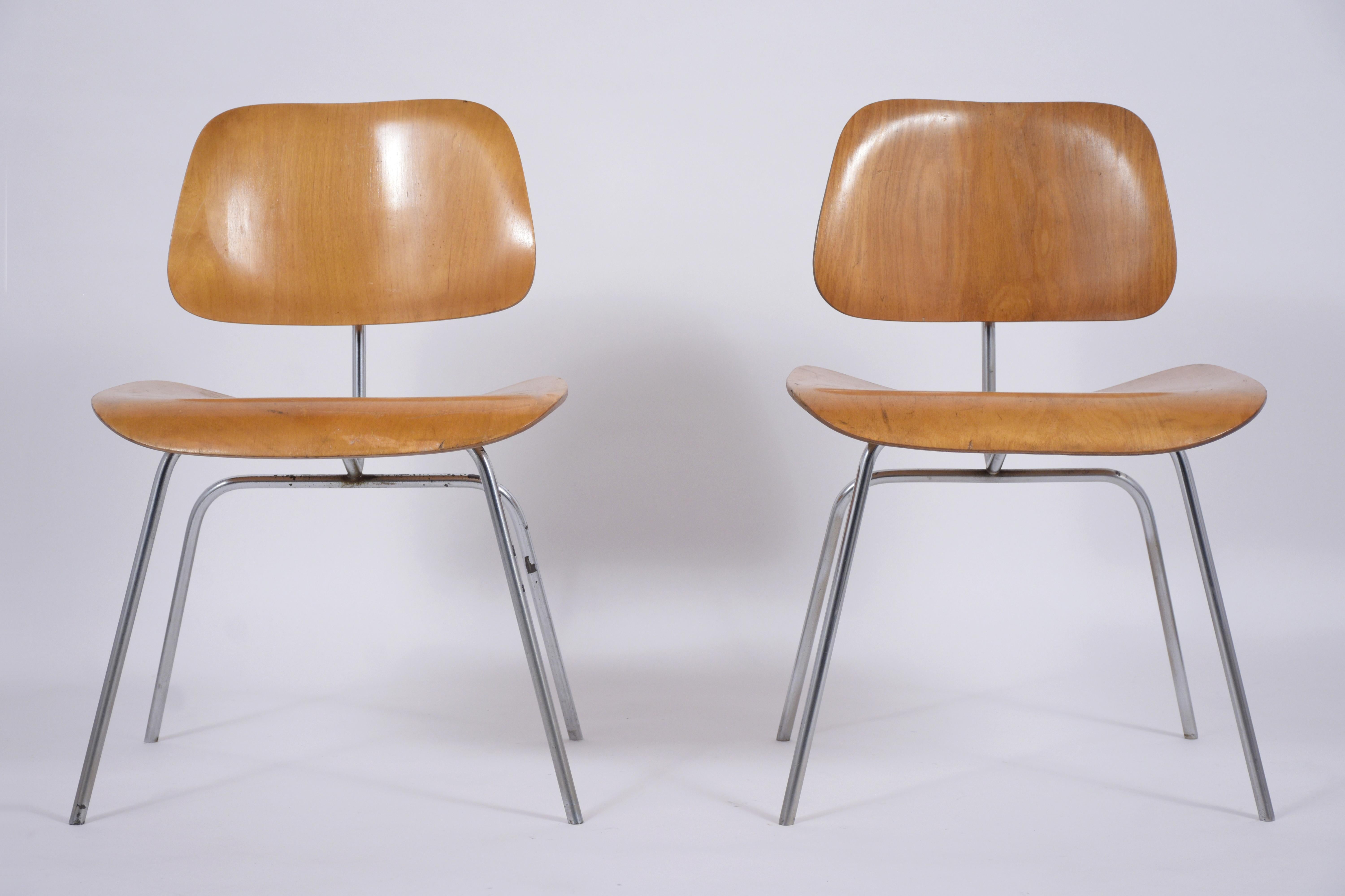 Step into the world of vintage elegance with our pair of early 1950s Mid-Century Modern Eames LCM lounge chairs by Herman Miller. In good condition and meticulously restored by our in-house team of expert craftsmen, these chairs are a testament to