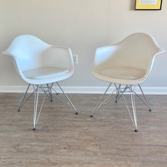 Pair of Eames Molded Plastic Armchairs
