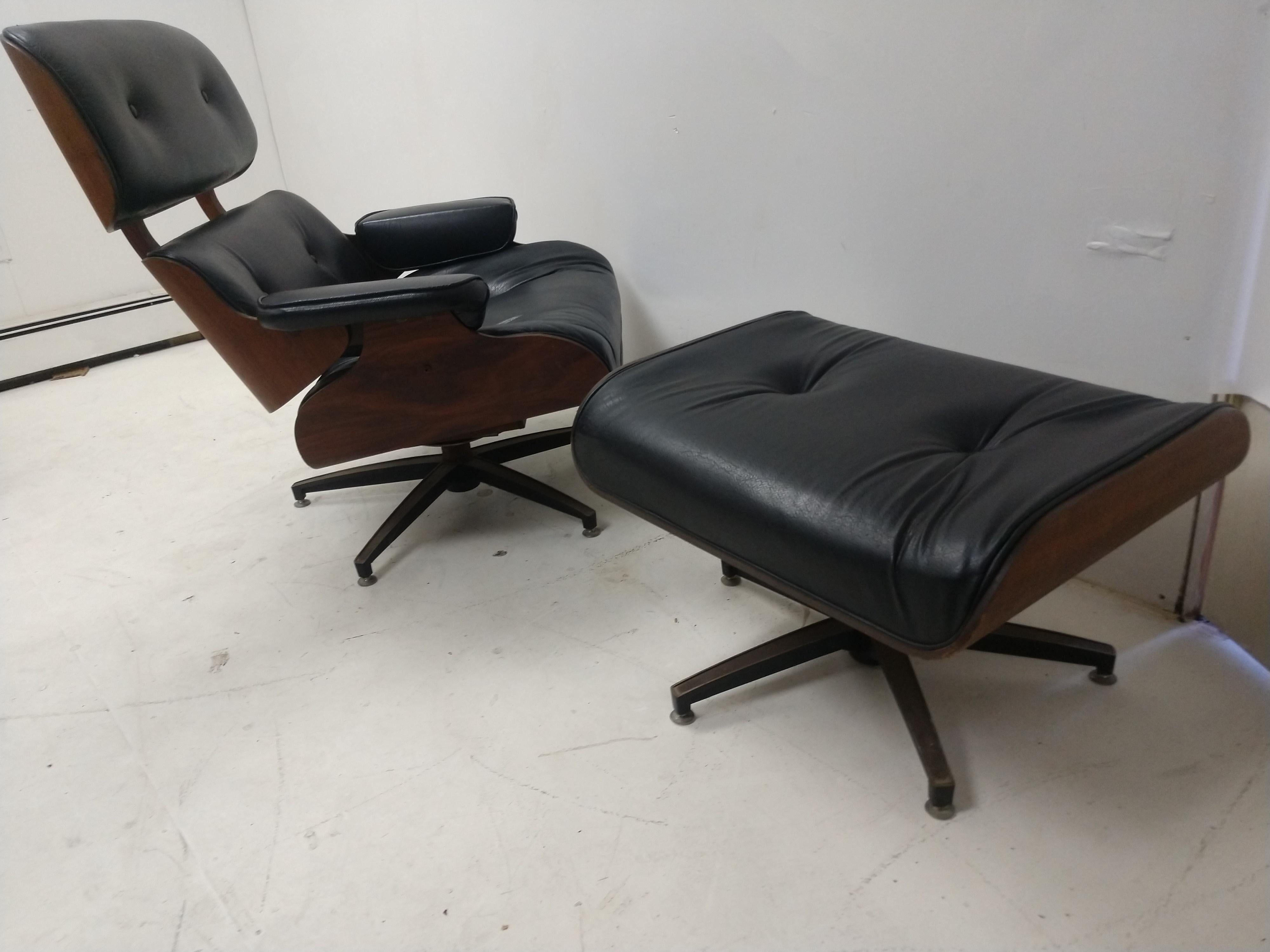 Fabulous pair of Mid-Century Modern lounge chairs most likely by Selig. Chairs are in excellent vintage condition with no tears or extreme wear naugehyde is in fabulous condition. Mechanicals are all good, chairs swivel easily.