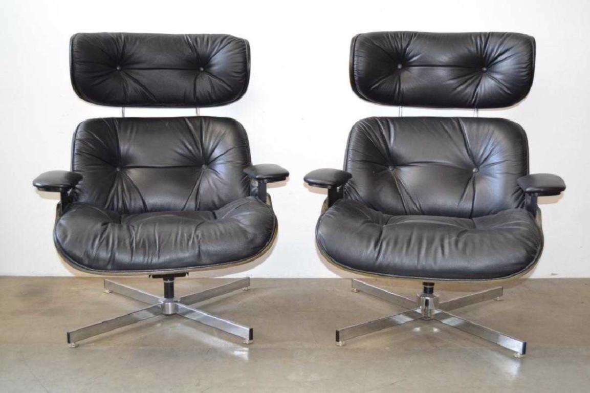 Pair of gorgeous Mid-Century Modern Lounge chairs with hard shell walnut frame, with matching ottomans,
Black leather, bentwood and chrome base.
Metal swivel and tilt back.
Both have ottomans tufted black leather on bentwood and a chrome base.