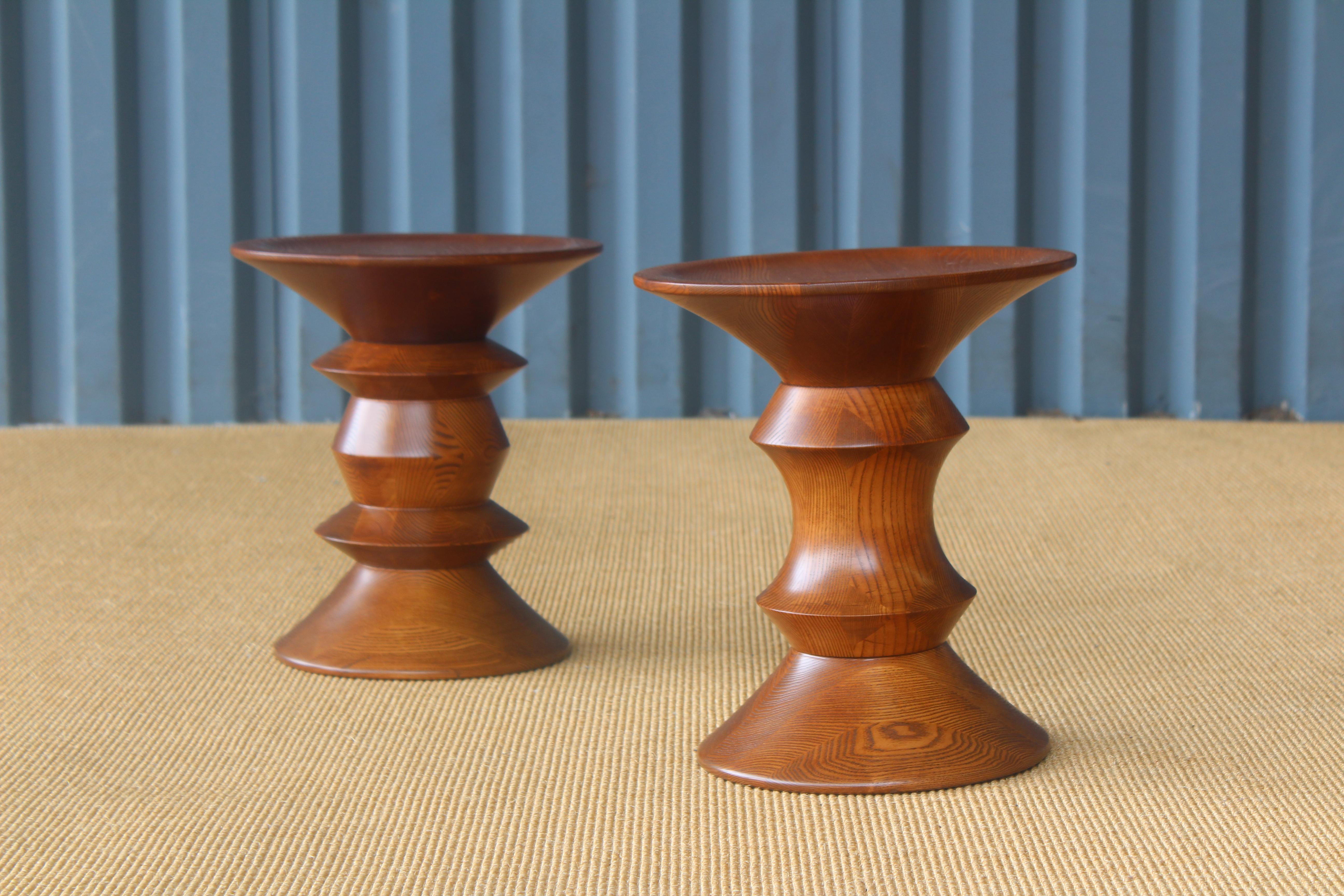 Pair of walnut 'Time Life' stools designed by Ray and Charles Eames. Recently refinished.