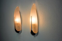 Pair of "ear" wall lights by idearte, smoked glass and silver metal, Spain, 1980