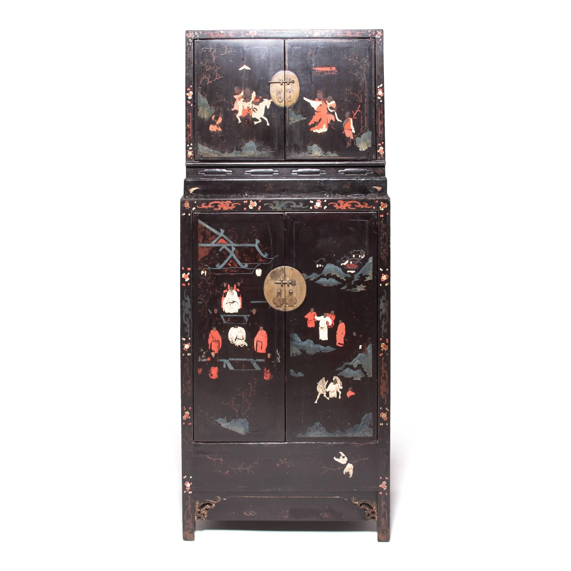 Seamlessly constructed and lacquered black, this pair of spectacular Ming-dynasty compound cabinets provided the perfect blank canvas for painted scenes of figures and horses in a garden landscape. Still vividly colored after centuries of use, the