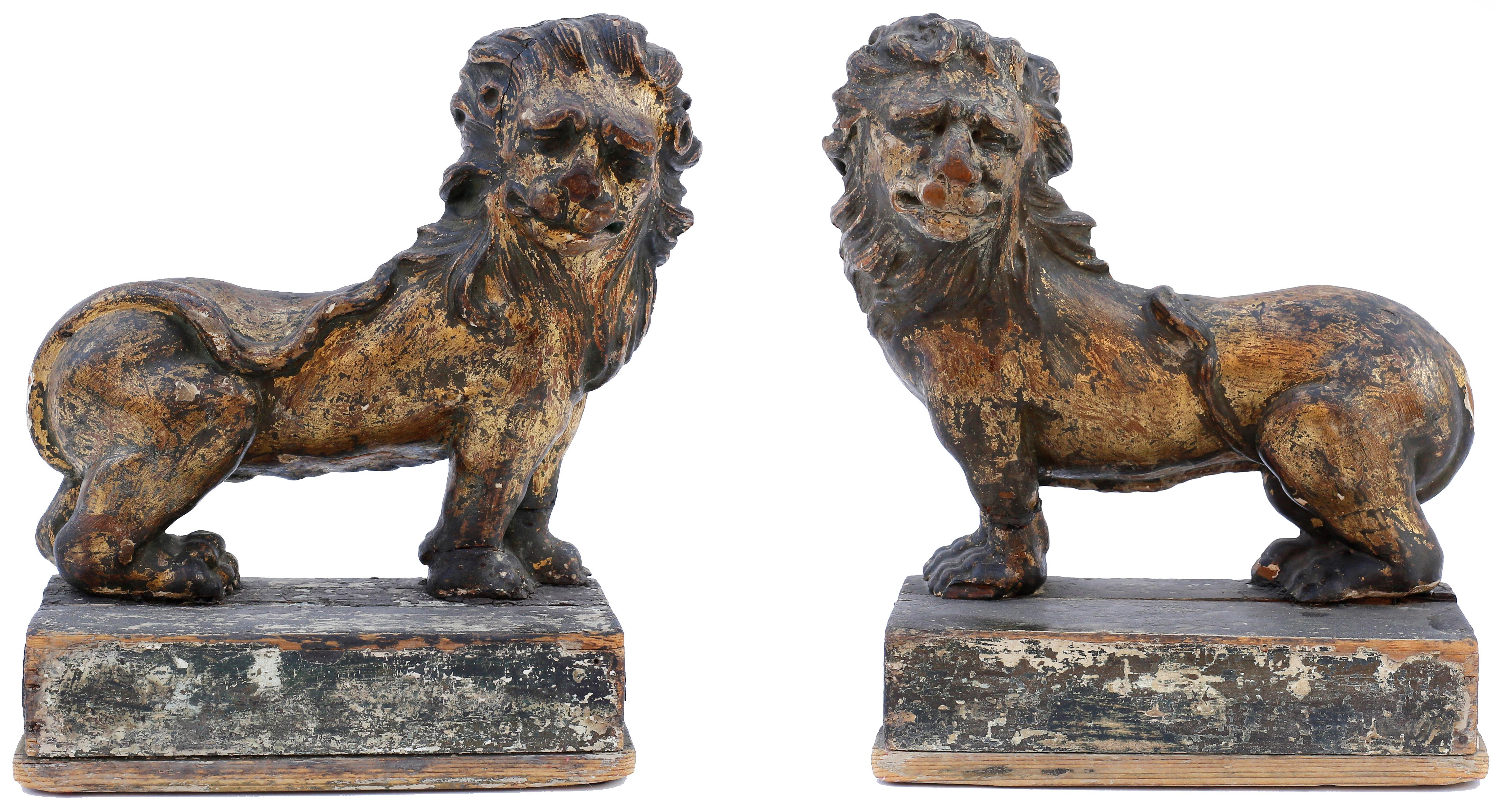 A magnificent pair of giltwood lions. The two animals call to mind England's Coronation chair, commissioned by King Edward I to contain the Stone of Scone brought to Westminster Abbey in 1296. Constructed four years later, the chair has been in use
