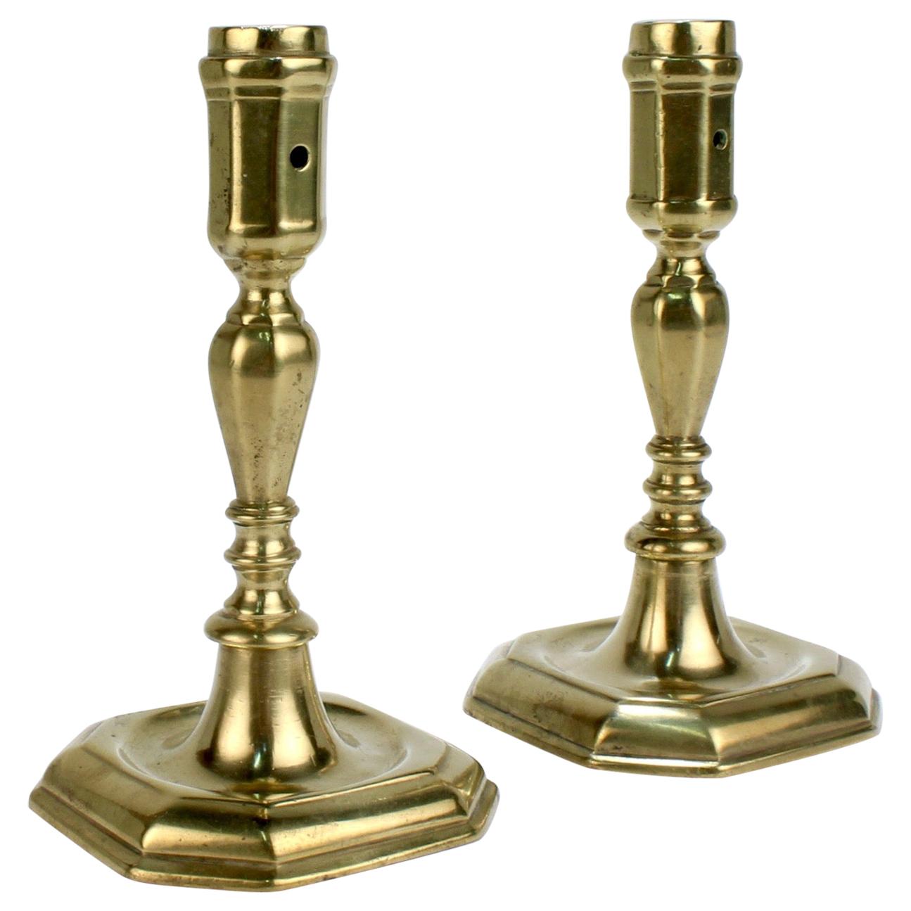 Pair of Early 18th Century French or English Faceted Brass Candlesticks