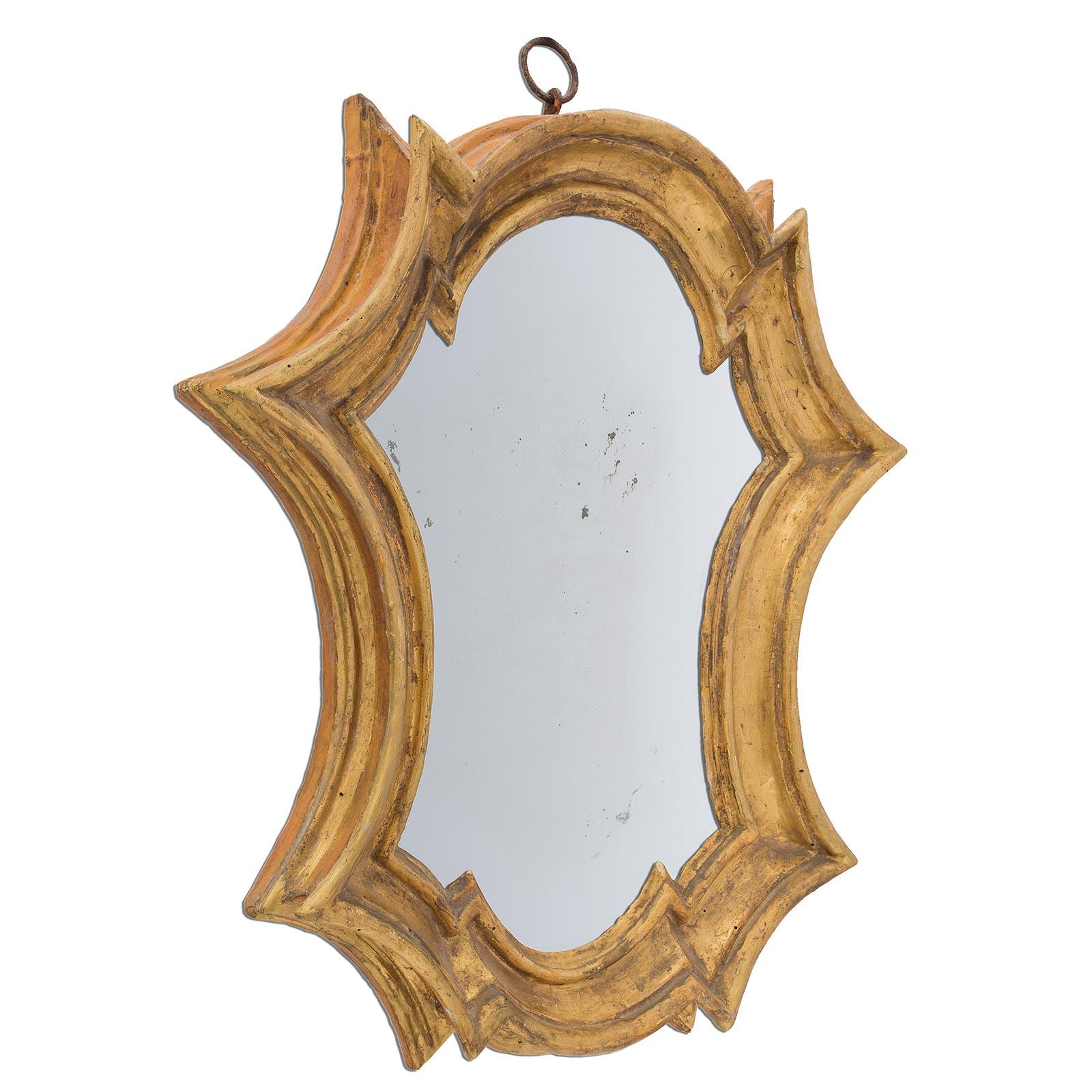 A very attractive and most decorative pair of early 18th century Italian Baroque period mirrors. The pair with an unusual shape have a thick mottled design with all original Mecca finish. At the top remains the original period iron loop.

 