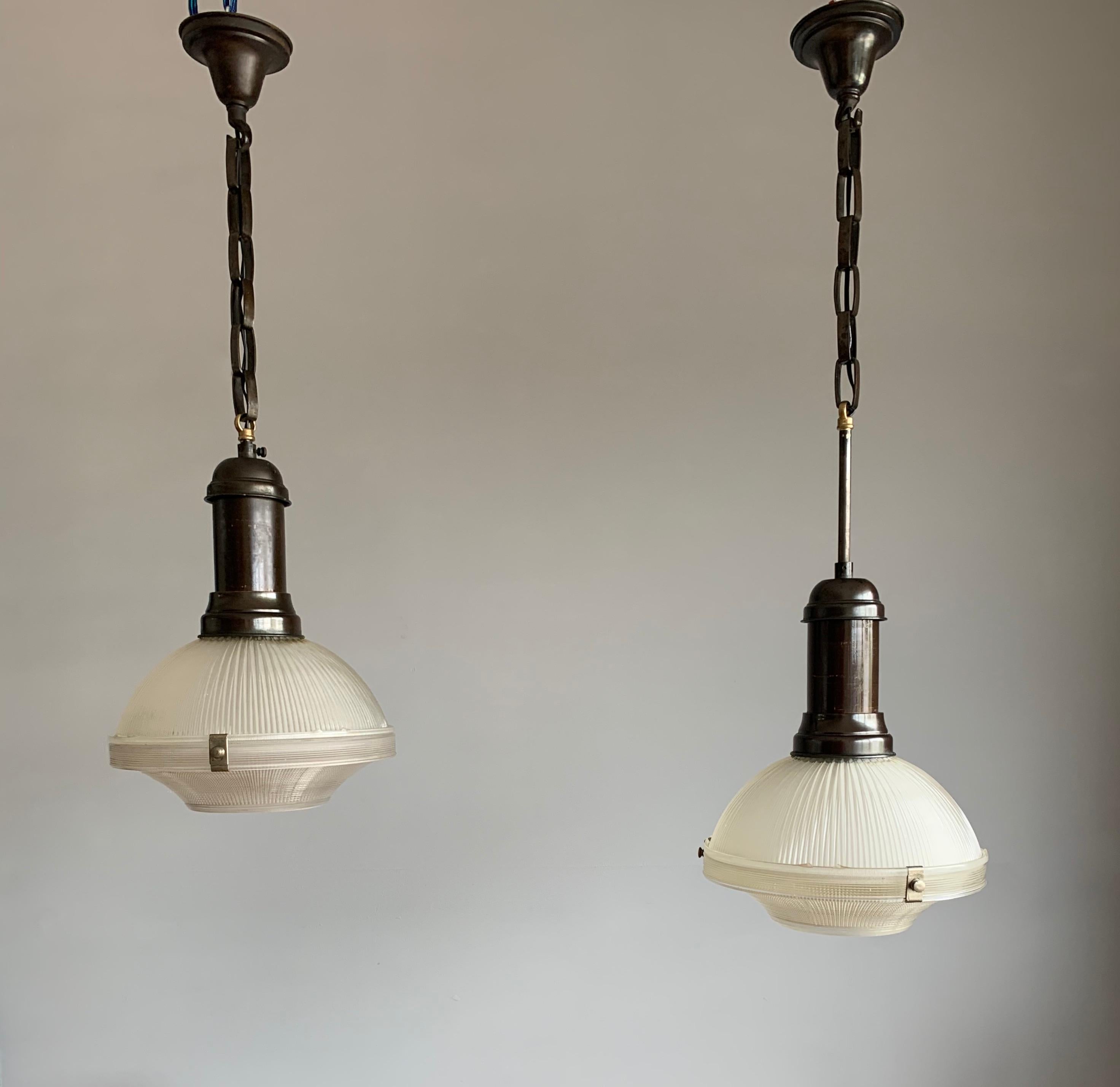 Top quality and condition, matching pair of Holophane light fixtures.

It does not matter whether you are decorating an Art Deco, a Mid-Century Modern or a more contemporary home or office, if you have the right space for them then this stunning,