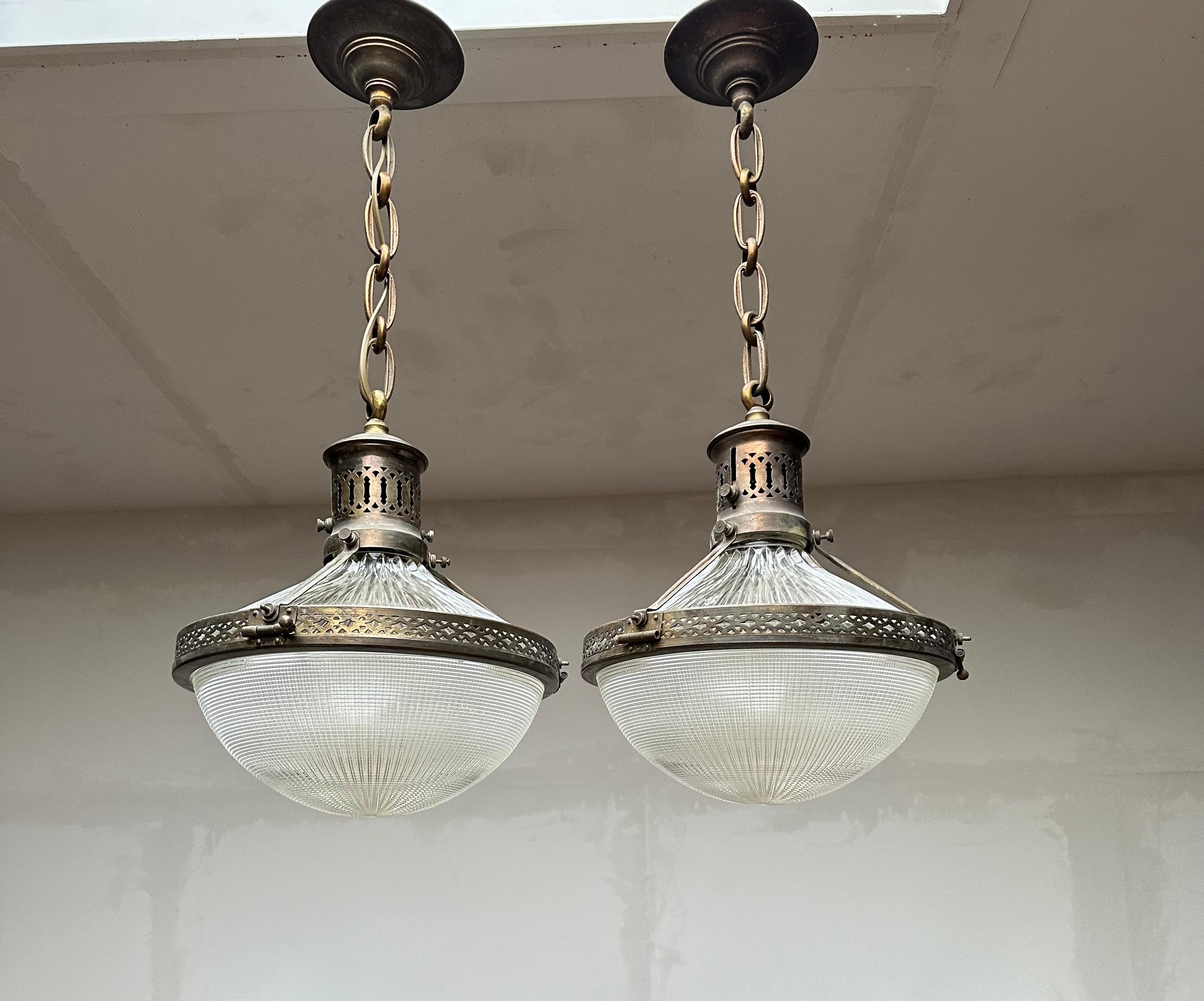 Top quality and condition, matching pair of Holophane light fixtures.

It does not matter whether you are decorating an Arts and Crafts, an Art Deco, a Mid-Century Modern or a more contemporary home or office, if you have the right space for them
