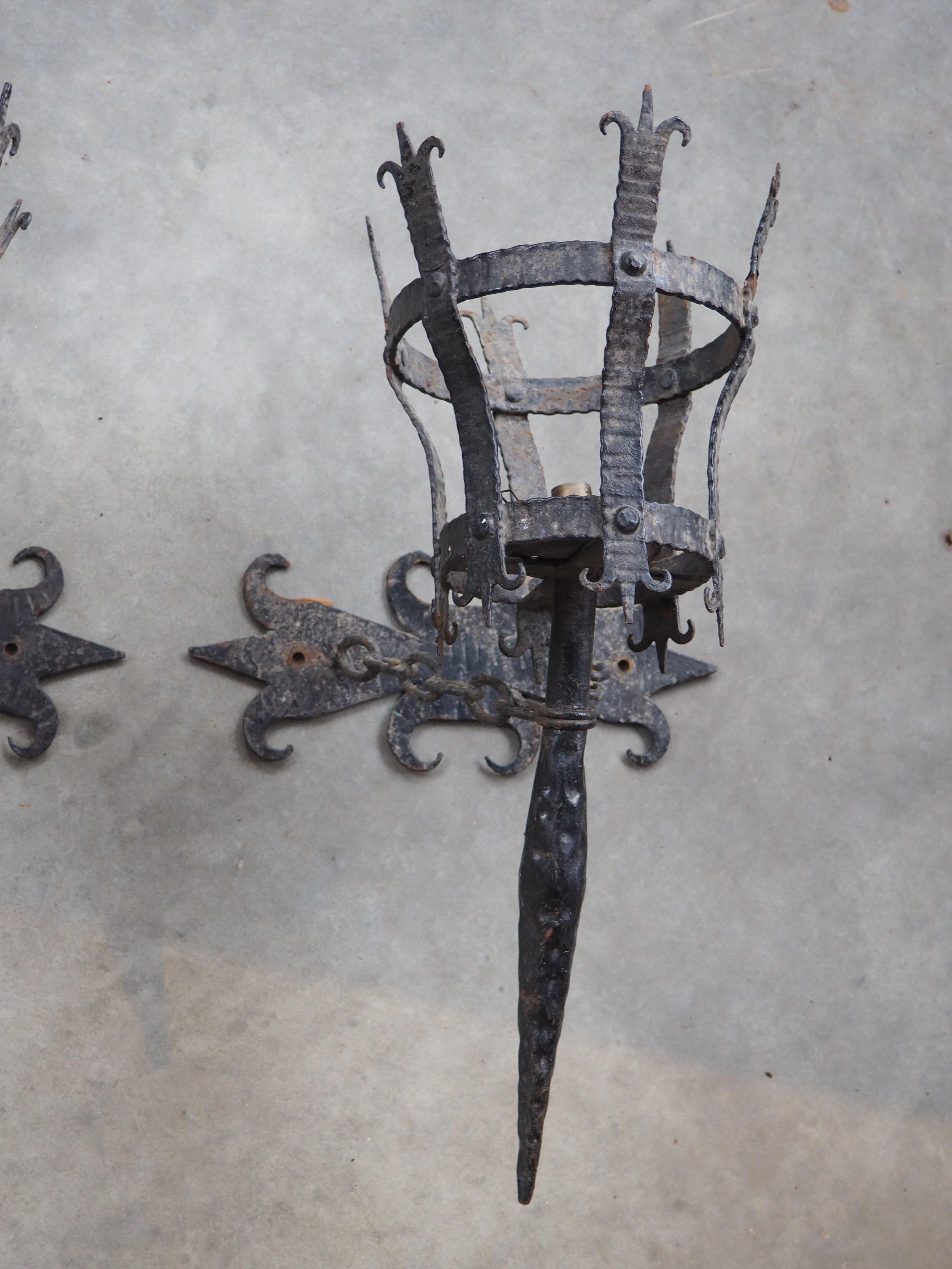 Metal Pair of Early 1900s French Medieval Style Wrought Iron Torch Sconces For Sale