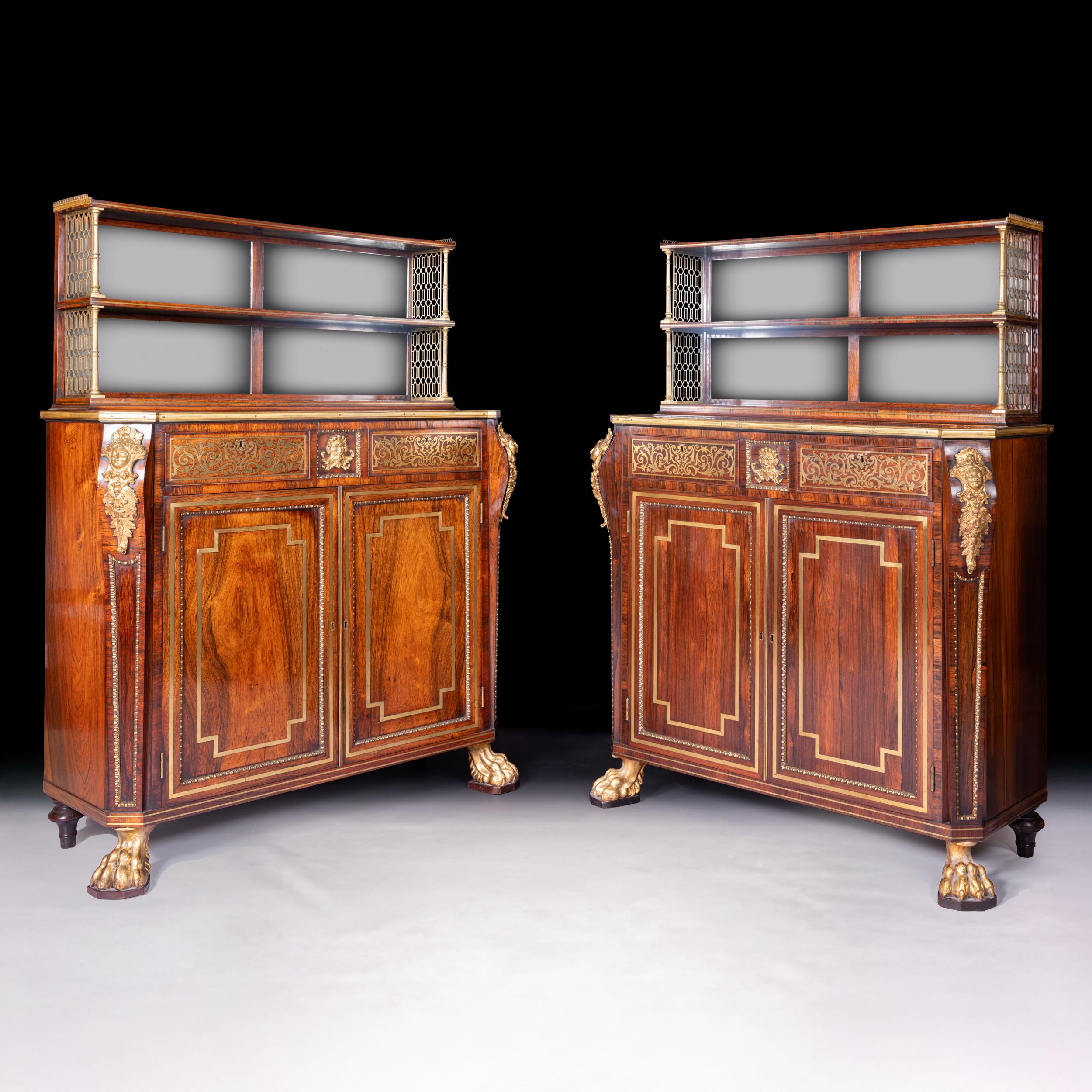 Une paire de cabinets Gonzalo Alves de style Régence attribués à John McLean, la partie supérieure avec des dos en miroir derrière deux étagères et surmontée d'une galerie percée aux trois quarts, le dessus avec des coins cannelés et tous deux