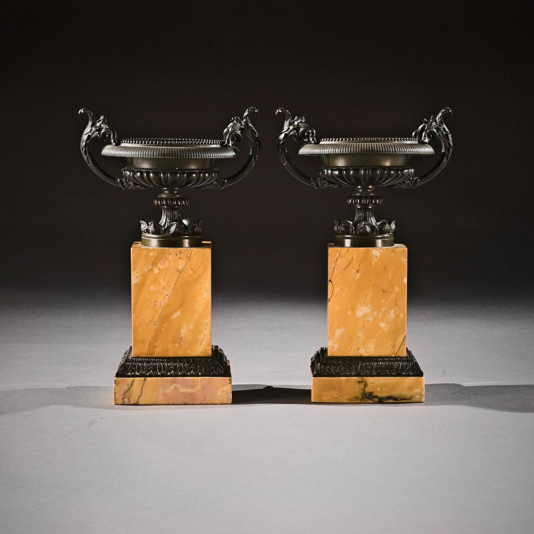 A larger than normal pair of early 19th century Grand Tour patinated bronze and Sienna marble tazzas in the neoclassical taste.

French, circa 1820.

Of large proportions standing 35cm in height, each patinated bronze Tazza having a beaded rim