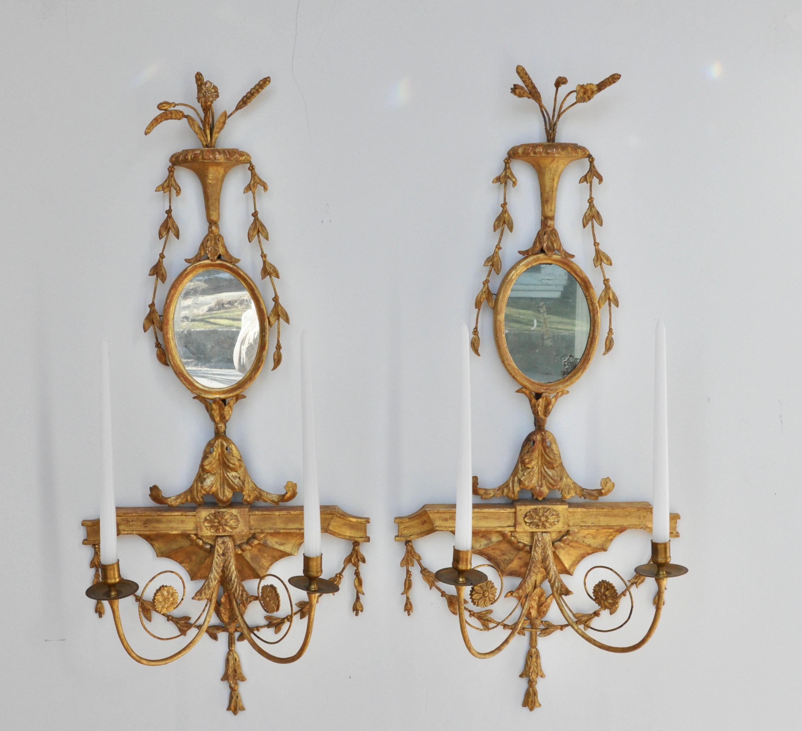 Pair of early 19th century Adam giltwood and mirrored sconces of the George III period

Original gilding. Quite desirable.