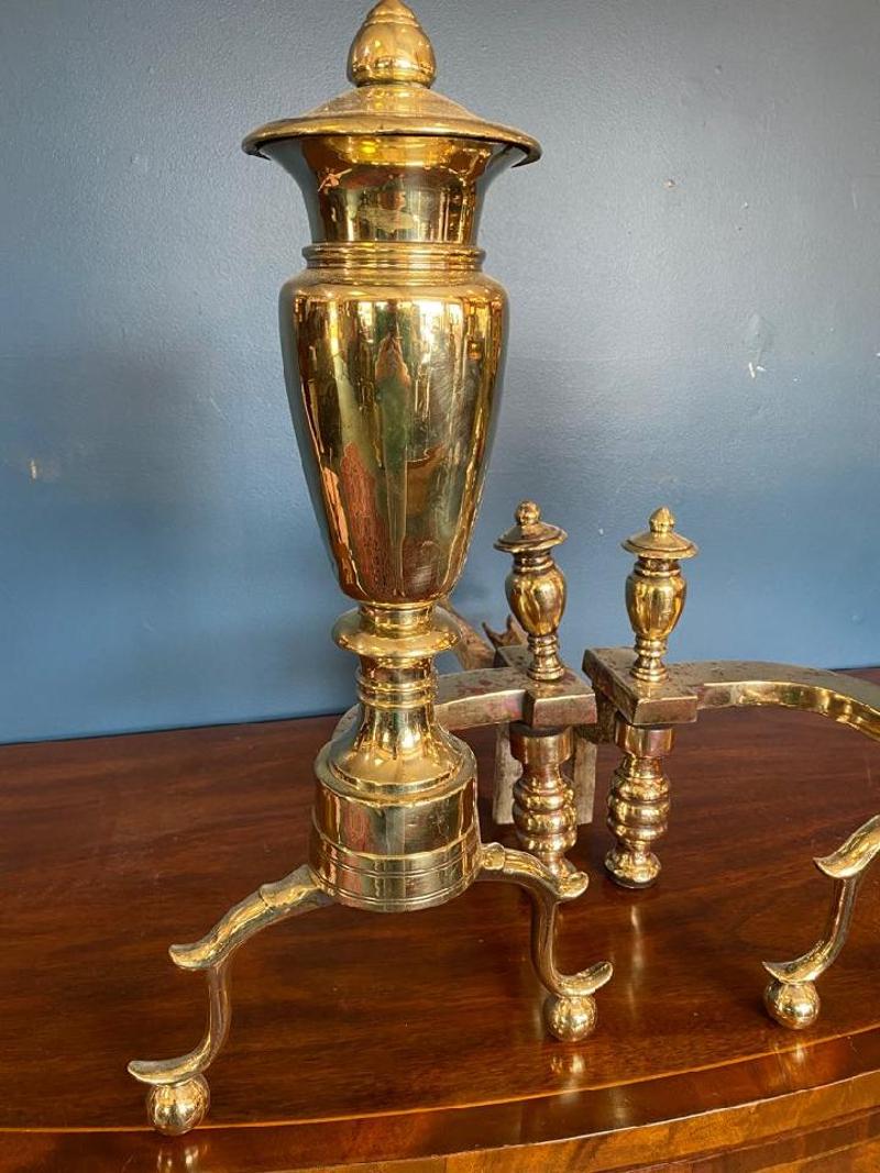 Pair of Early 19th Century American Empire Brass Fireplace Andirons. Beautifully bright brass with the shape of an urn on top. United States, 1801-1830.
Measures: 21