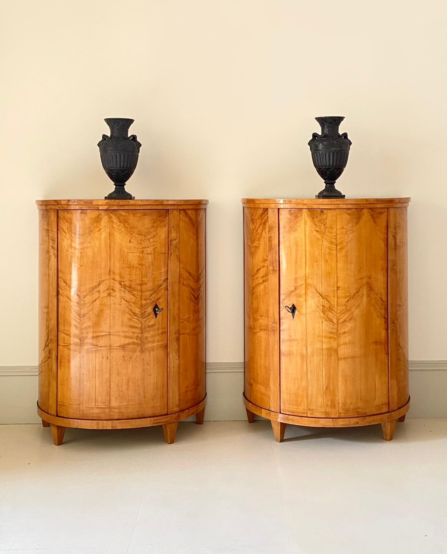 German Pair of early 19th Century Biedermeier Maple Demi-lune Side Cabinets.