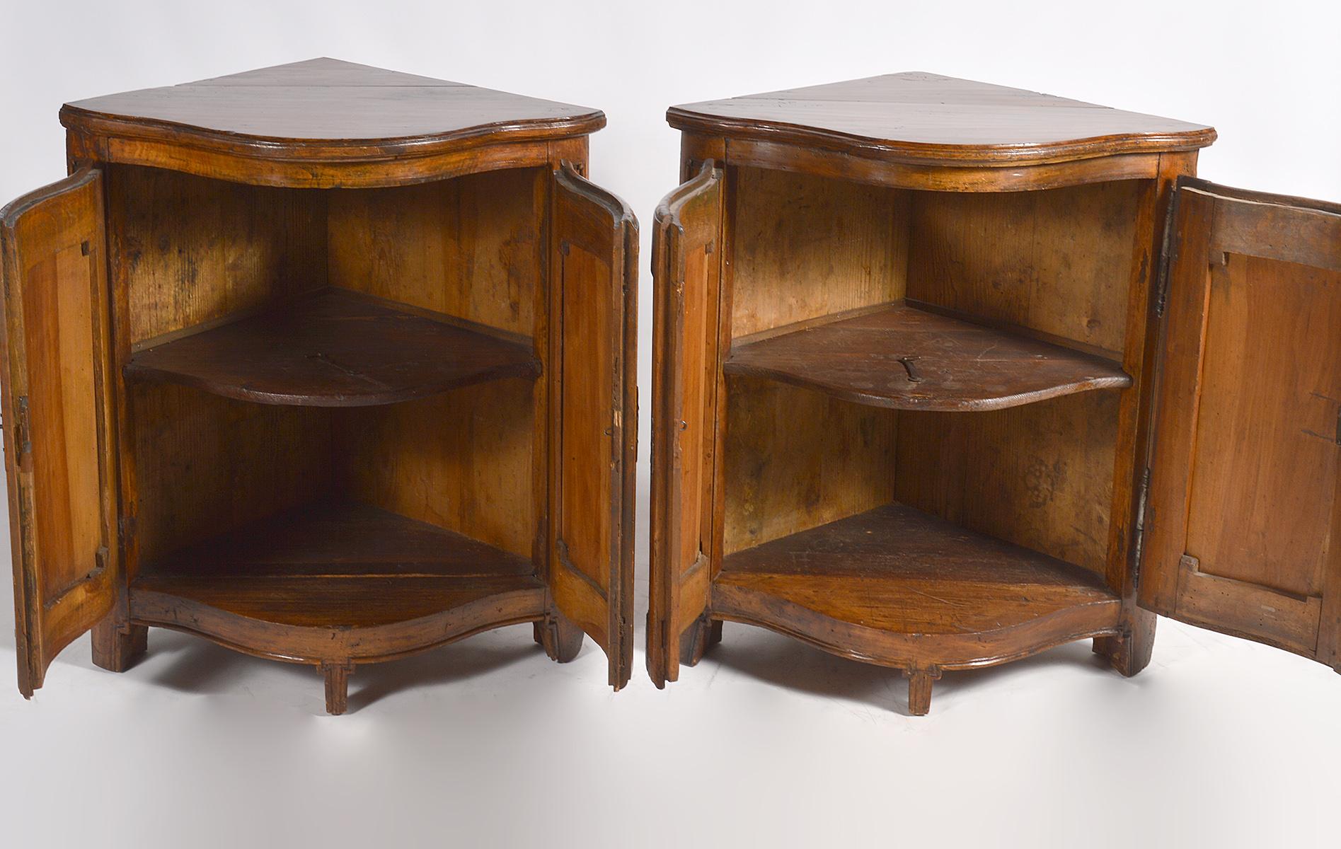 Iron Pair of Early 19th Century Carved French Provincial Serpentine Corner Cabinets