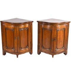 Pair of Early 19th Century Carved French Provincial Serpentine Corner Cabinets