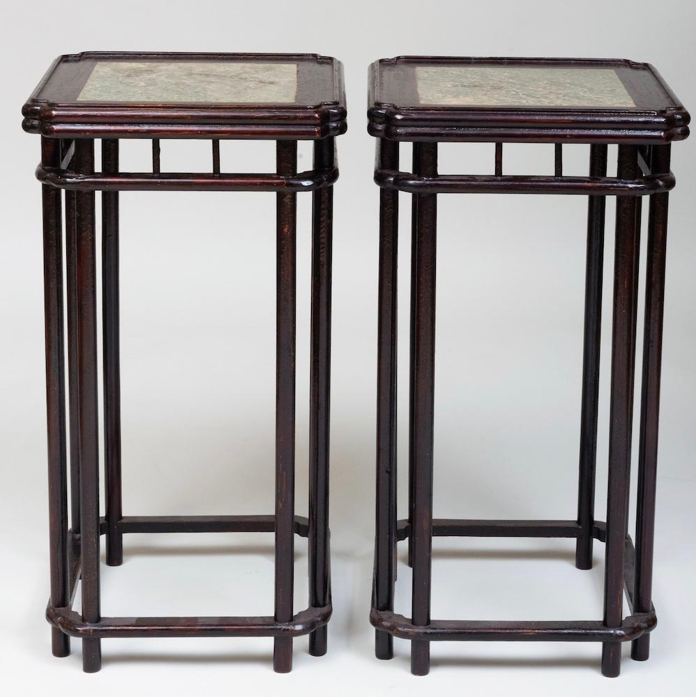 Pair of antique Chinese pedestals with soft green colored marble square set into rounded beveled tops.