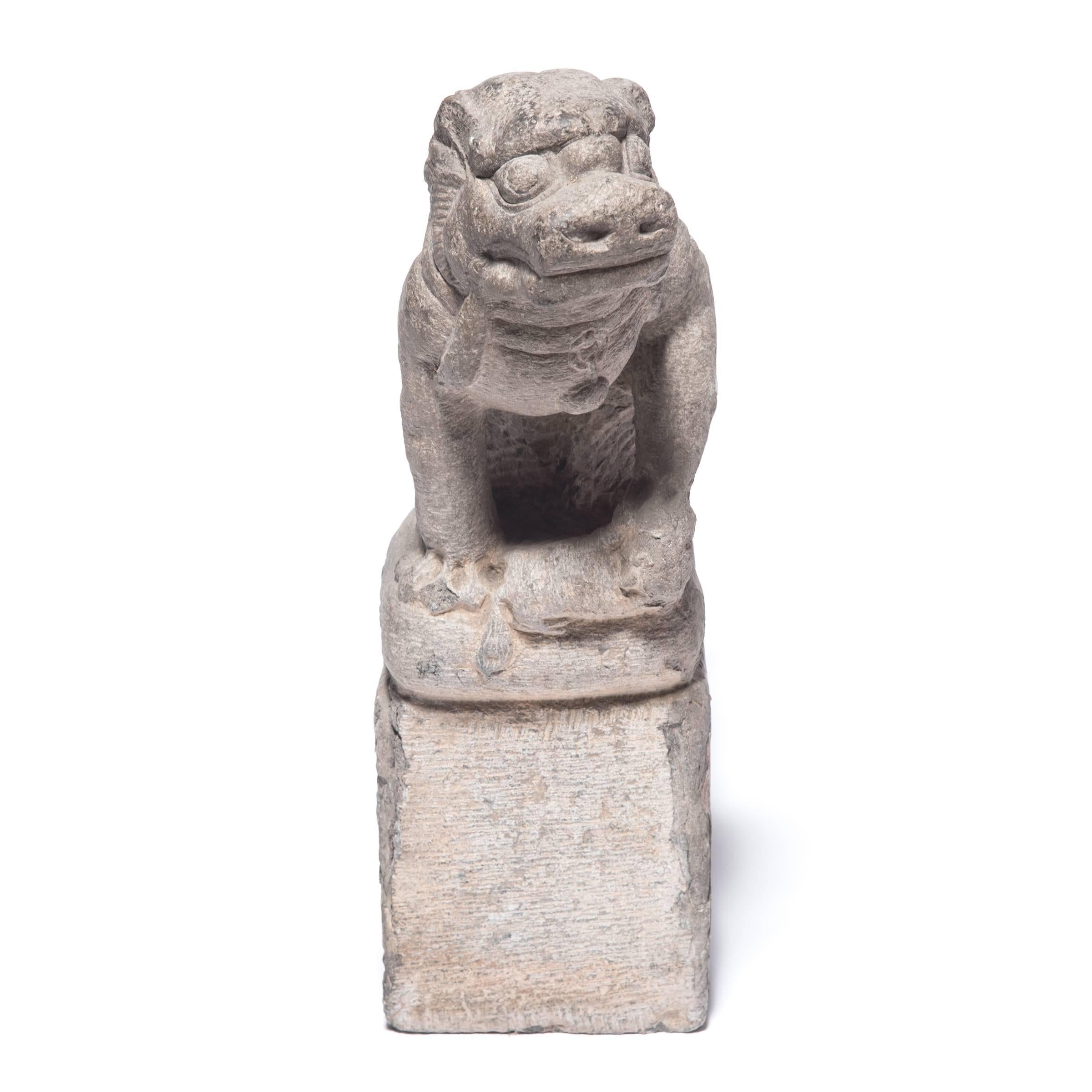 This pair of limestone Fu dogs once protected a grand courtyard home in 19th century, China. Skilfully carved in attentive postures, the lion-like dogs are “shizi,” symbols of power and grandeur that were believed to offer protection from evil
