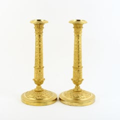 Pair of Early 19th Century Empire Trajan's Column Ormolu Candlesticks