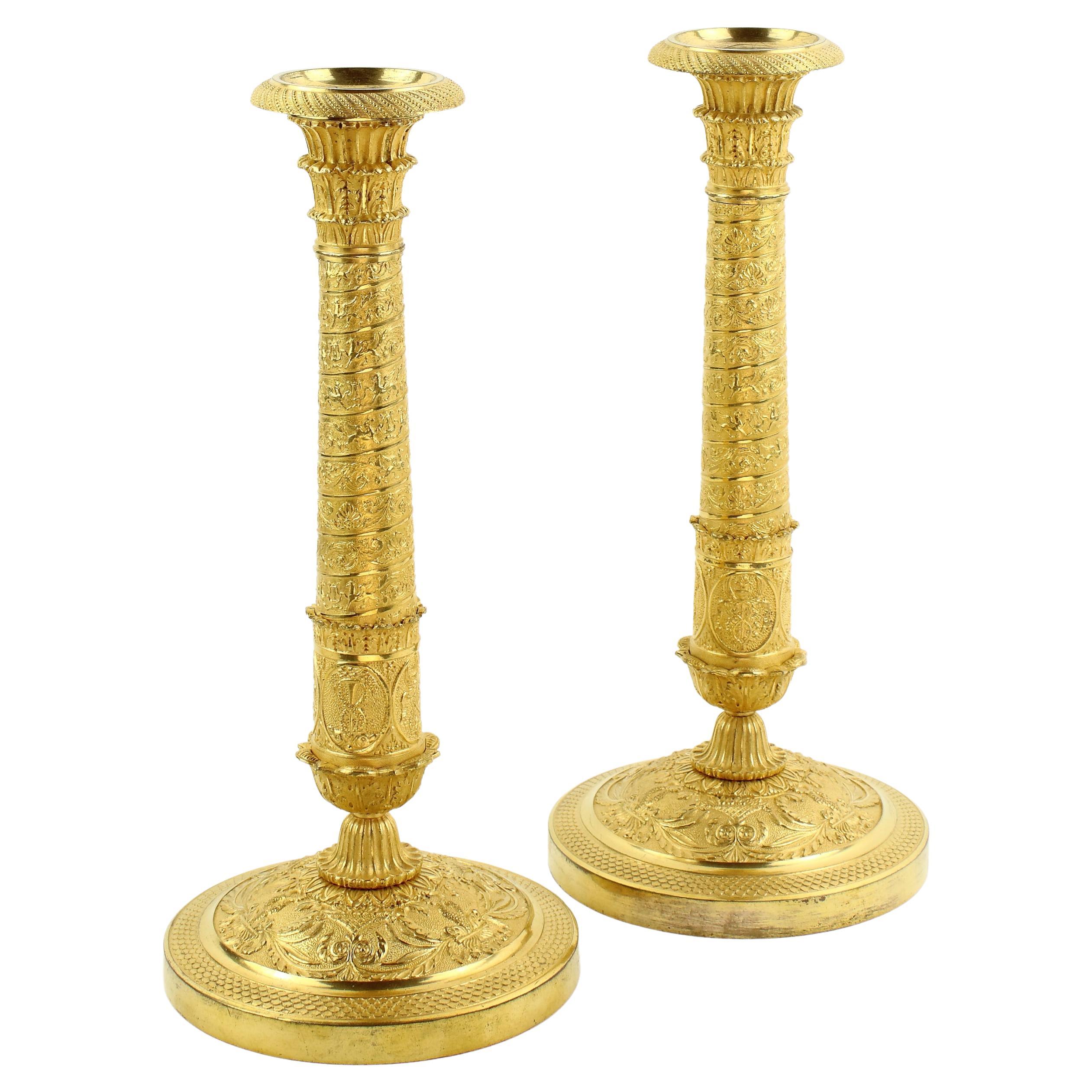Pair of Early 19th Century Empire Trajan's Column Ormolu Candlesticks For Sale