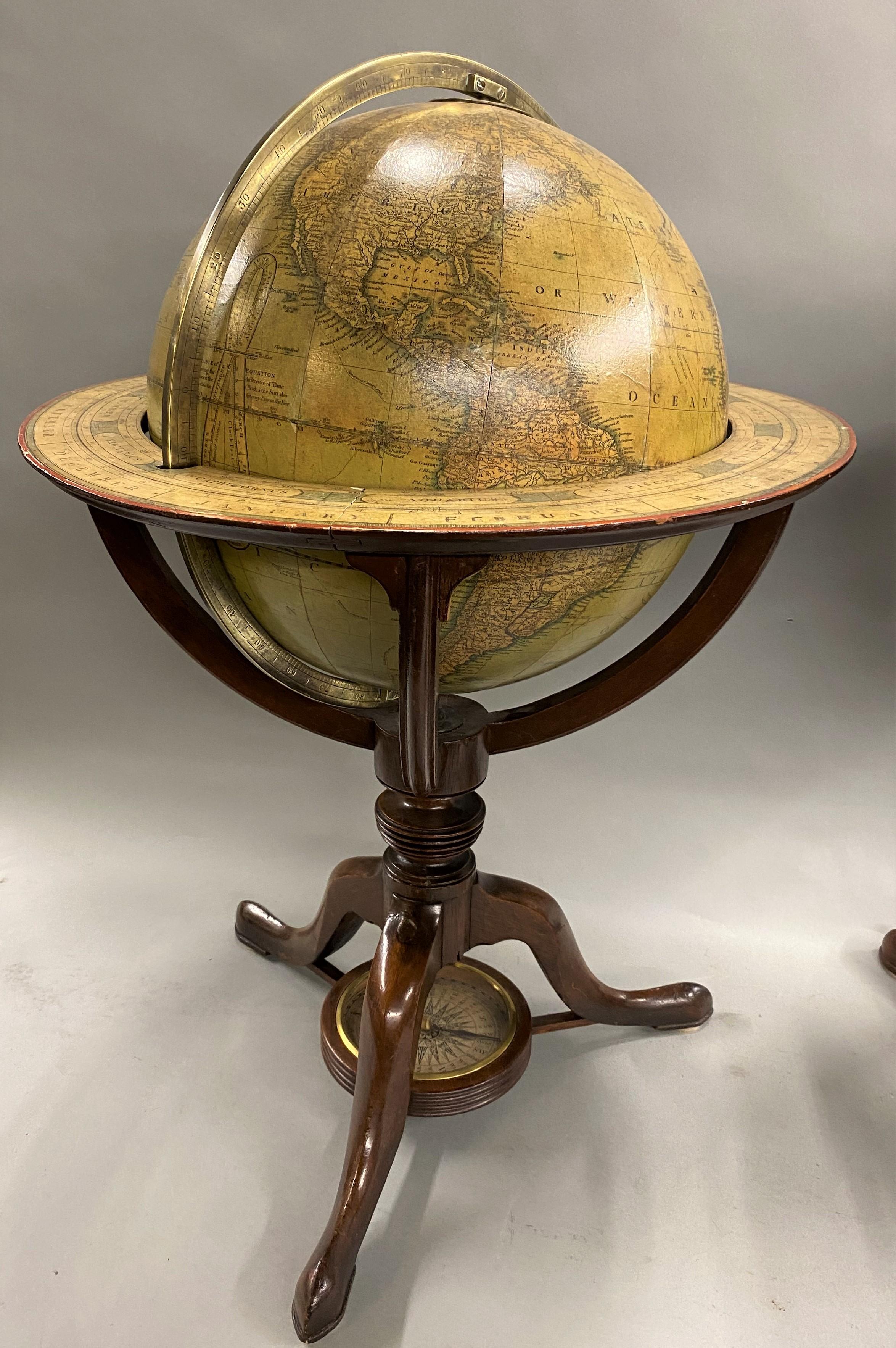 A fine pair of 12-inch English table model globes on stands, manufactured by G.& J. Cary, the left globe with cartouche labeled “Carey’s New Terrestrial Globe, delineated from the best Authorities extant, Exhibiting the late Discoveries towards the