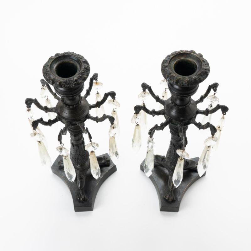 Pair of cast bronze candle sticks with luster rings.
England, circa 1830-40.