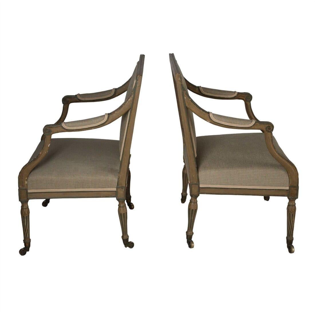 Handsome and well drawn pair of English fauteuils in Louis XVI style, circa 1810. Old paint, but not original. Seat height 43cm, seat depth 51cm.