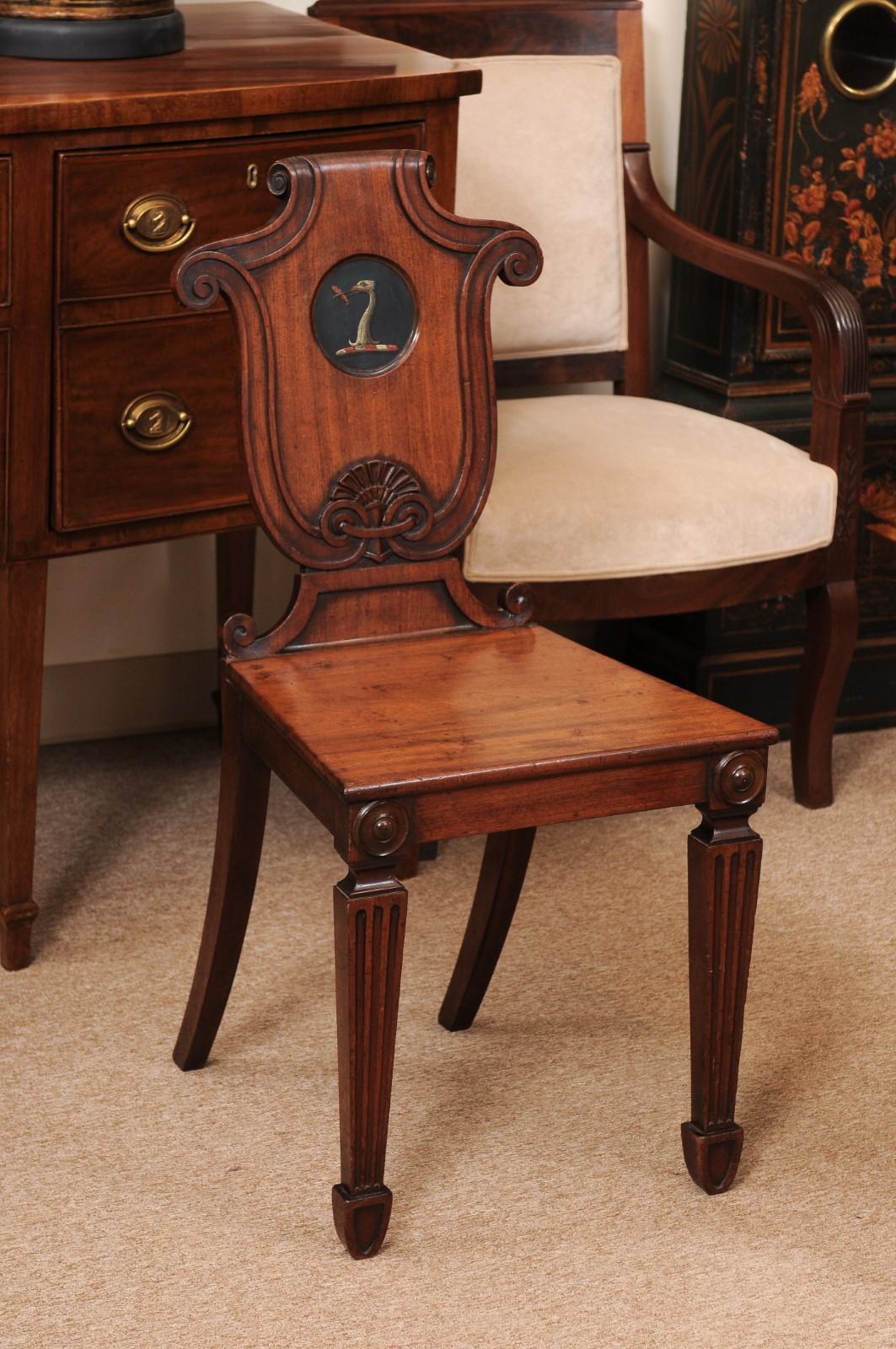 Pair of Early 19th Century English Mahogany Hall Chairs with Black Painted Crest In Fair Condition For Sale In Atlanta, GA