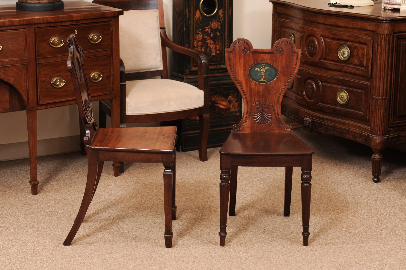 Pair of Early 19th Century English Mahogany Hall Chairs with Black Painted Crest For Sale 2