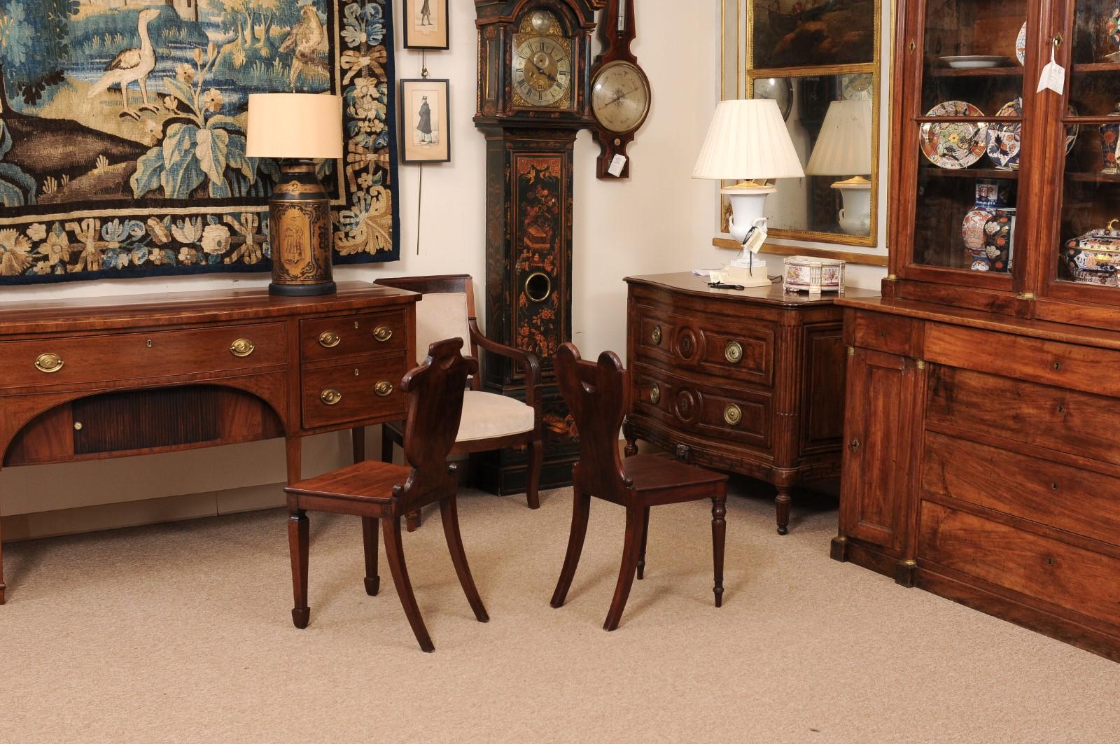 Pair of Early 19th Century English Mahogany Hall Chairs with Black Painted Crest For Sale 4