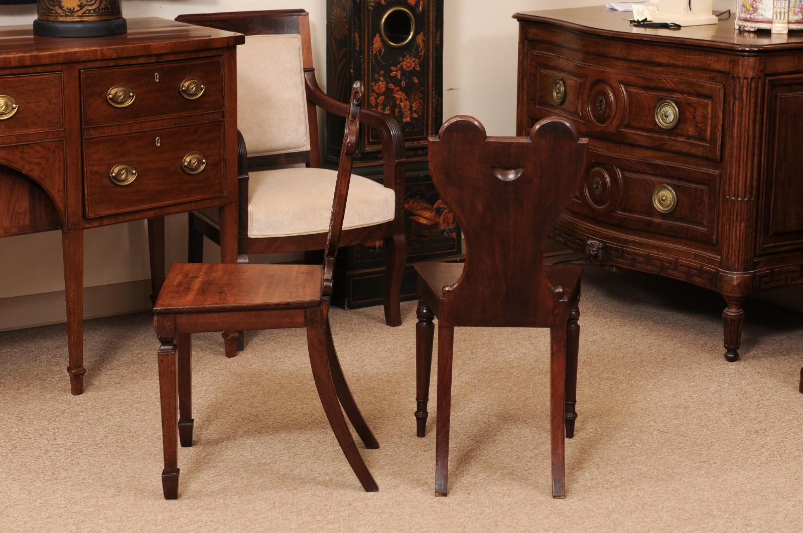 Pair of Early 19th Century English Mahogany Hall Chairs with Black Painted Crest For Sale 5