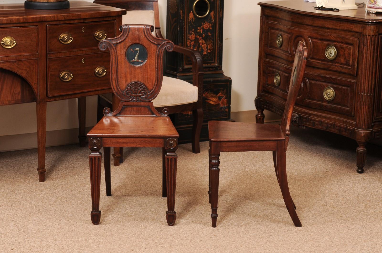 Pair of Early 19th Century English Mahogany Hall Chairs with Black Painted Crest For Sale 6