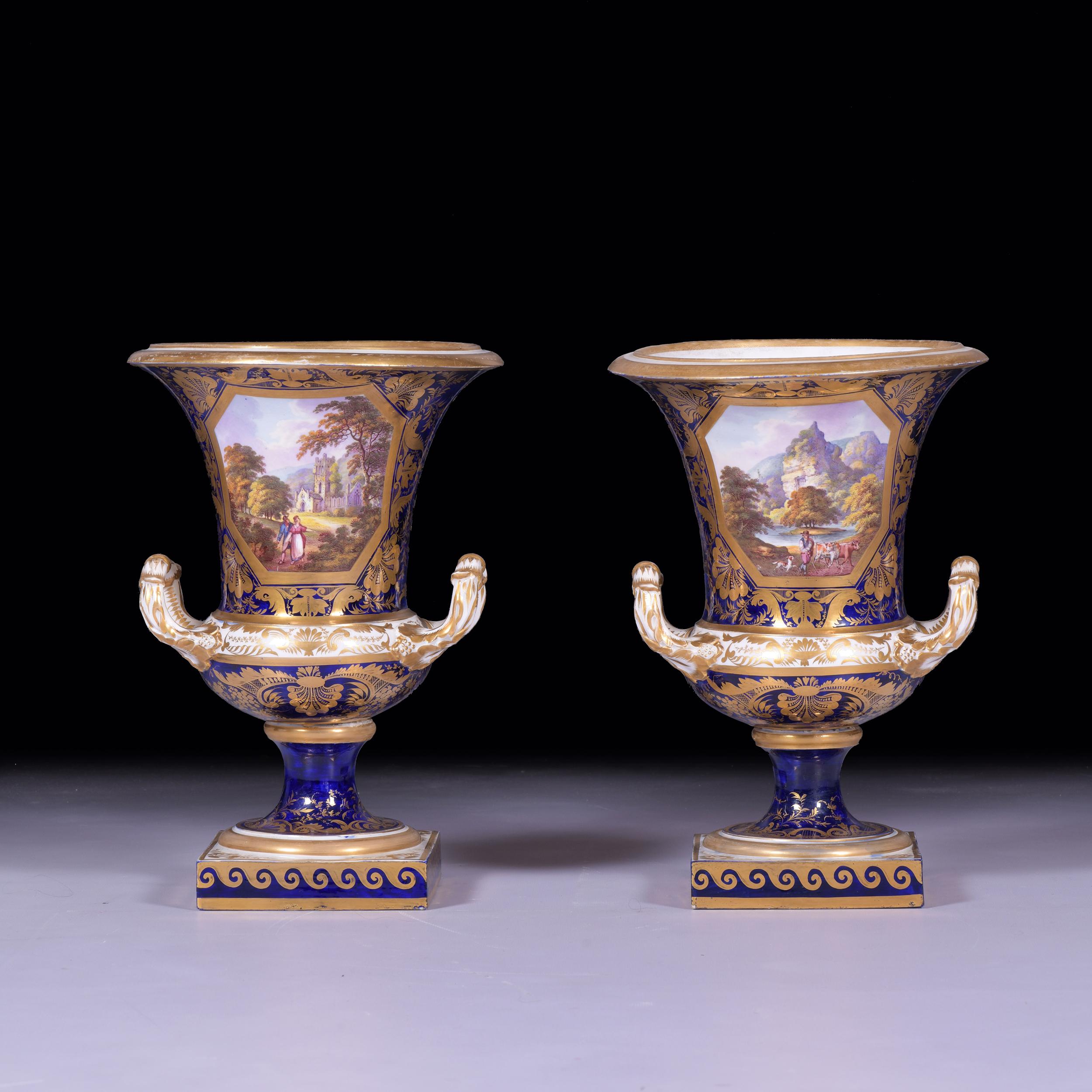 A stunning pair of early 19th century cobalt - blue vases by Crown Derby, each painted with a bucolic scene within a gilt cartouche on a blue ground, one inscribed: View in Scotland, the other inscibed: On the river Dove, Derbyshire.

Royal Crown