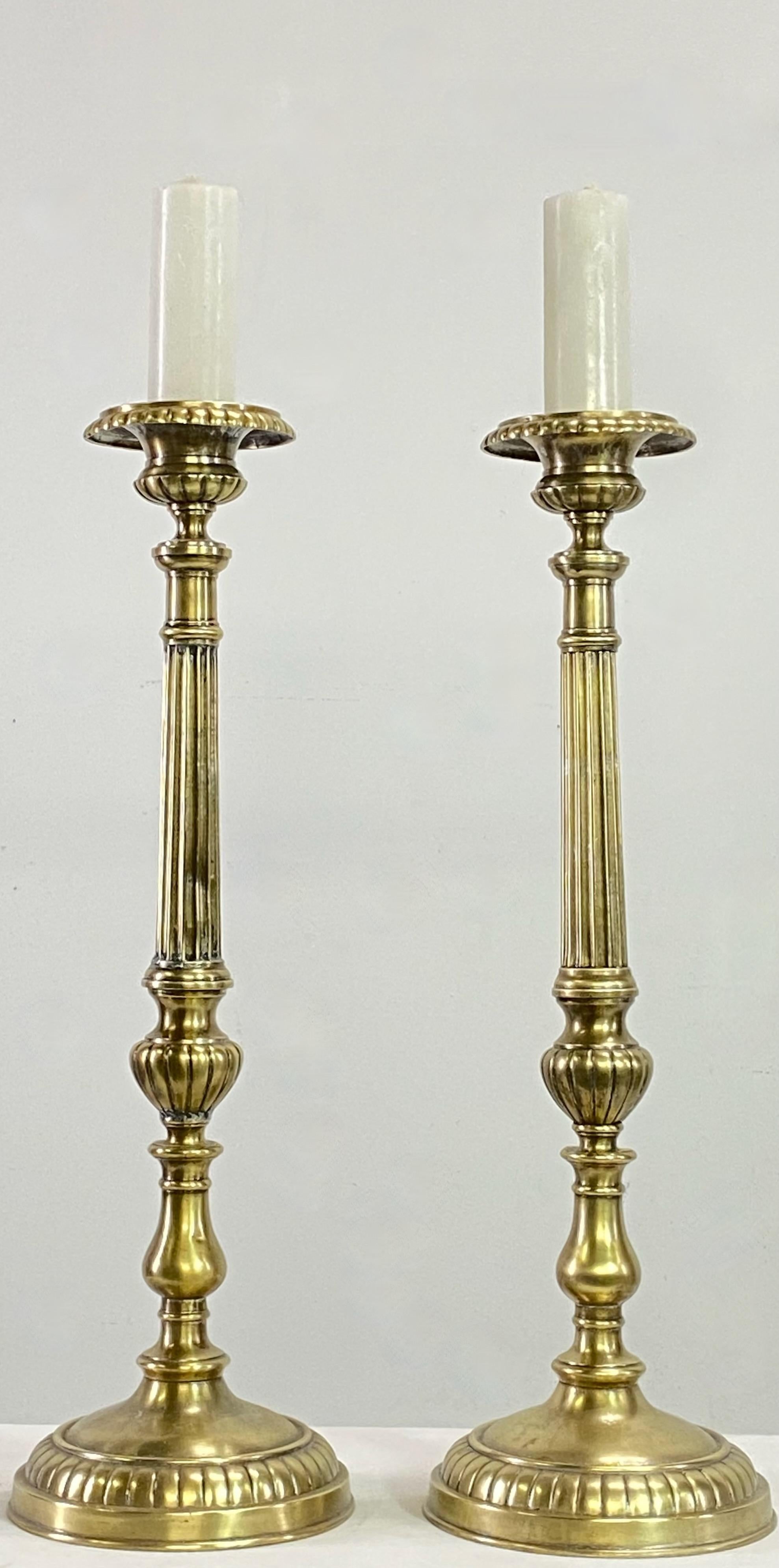 A pair of European brass candlesticks.
Spun, cast and hand chased brass, and were originally silver plated.
These had been electrified at one time and could easily be again if desired.
Having some expected light dents and signs of age, and minor