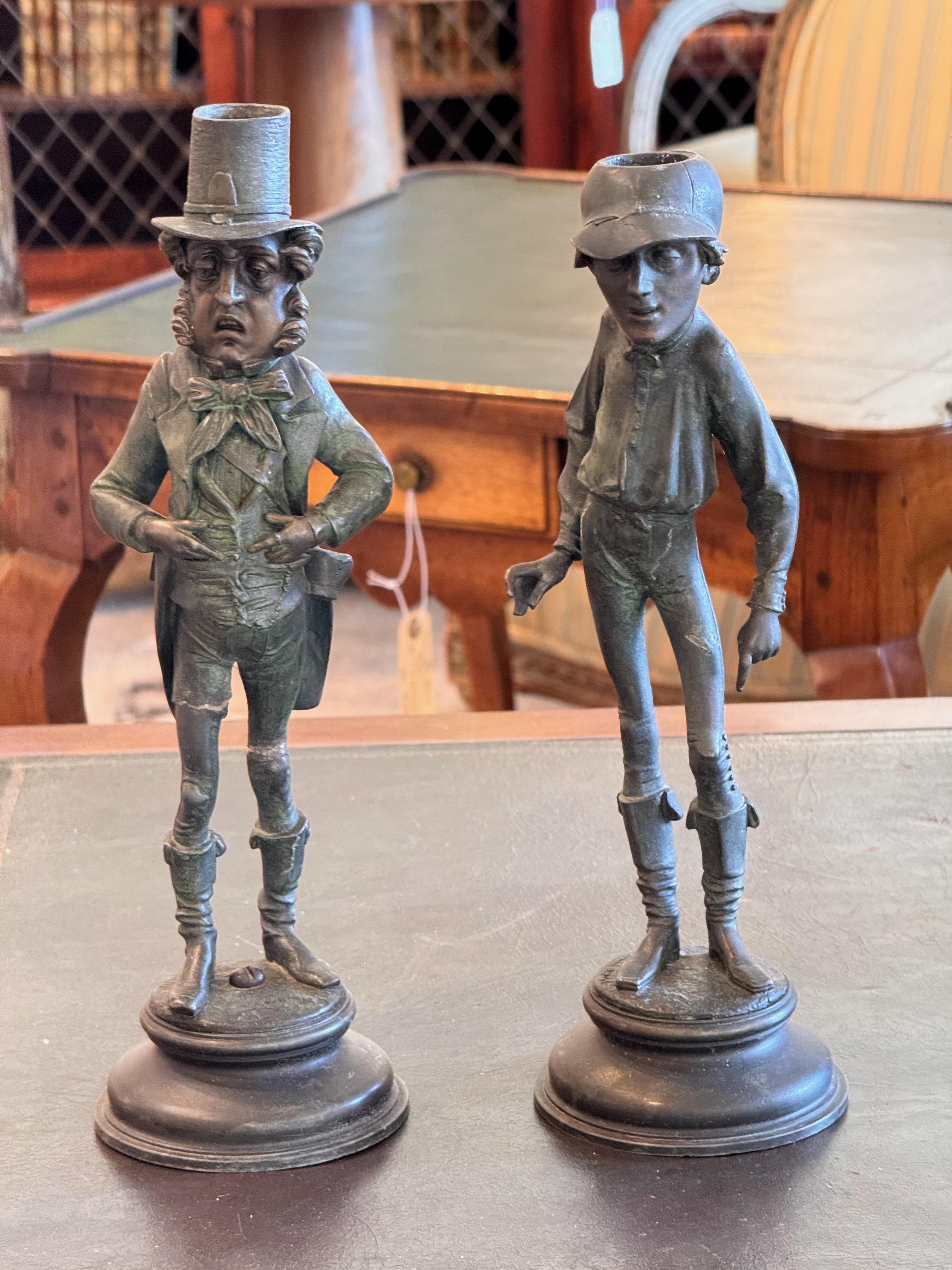 A whimsical pair of candlesticks. They are bronze. By Emile Guilleman