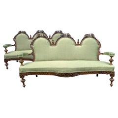 Pair of Early 19th Century French Carved Walnut Serpentine Sofas