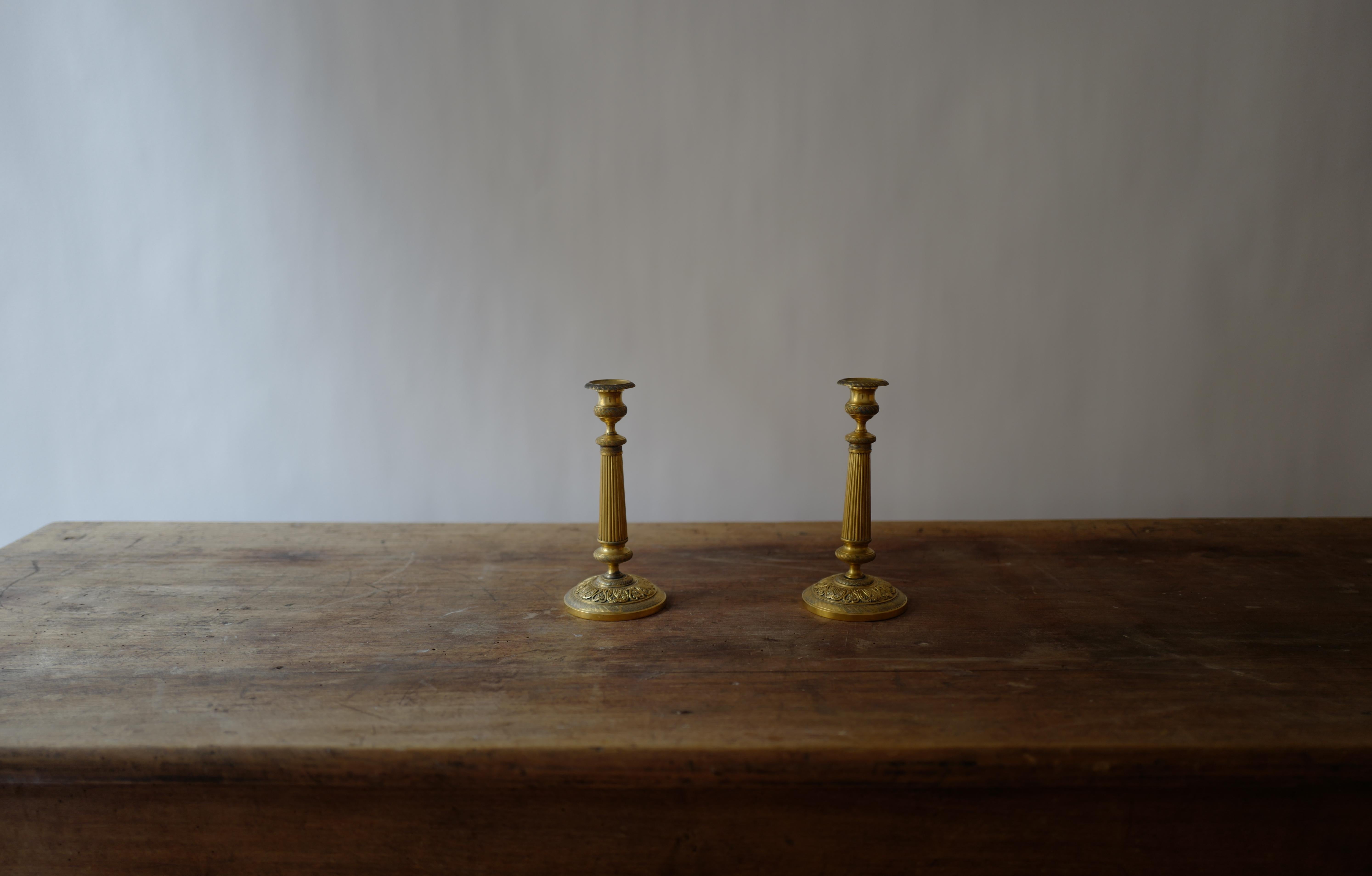 Pair of early 19th century French Empire gilt bronze candlesticks. Stunning condition.