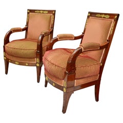 Pair of Early 19th Century French Empire Mahogany Armchairs called " A La Reine"