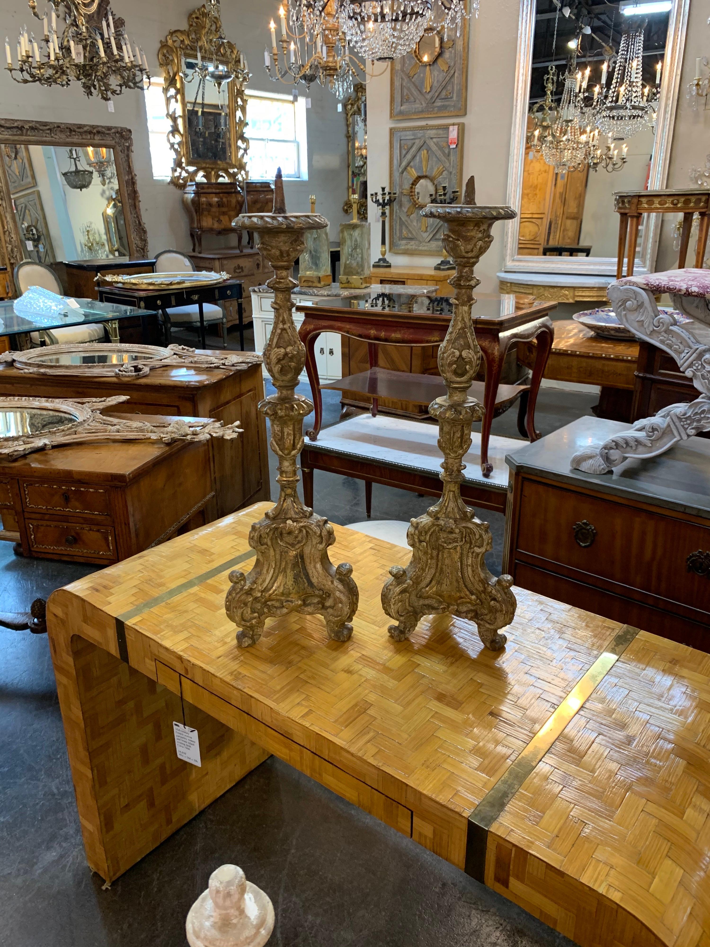 Lovely pair of 19th century Italian carved giltwood altar prickets. Very fine carvings make these an beautiful and impressive accessory!