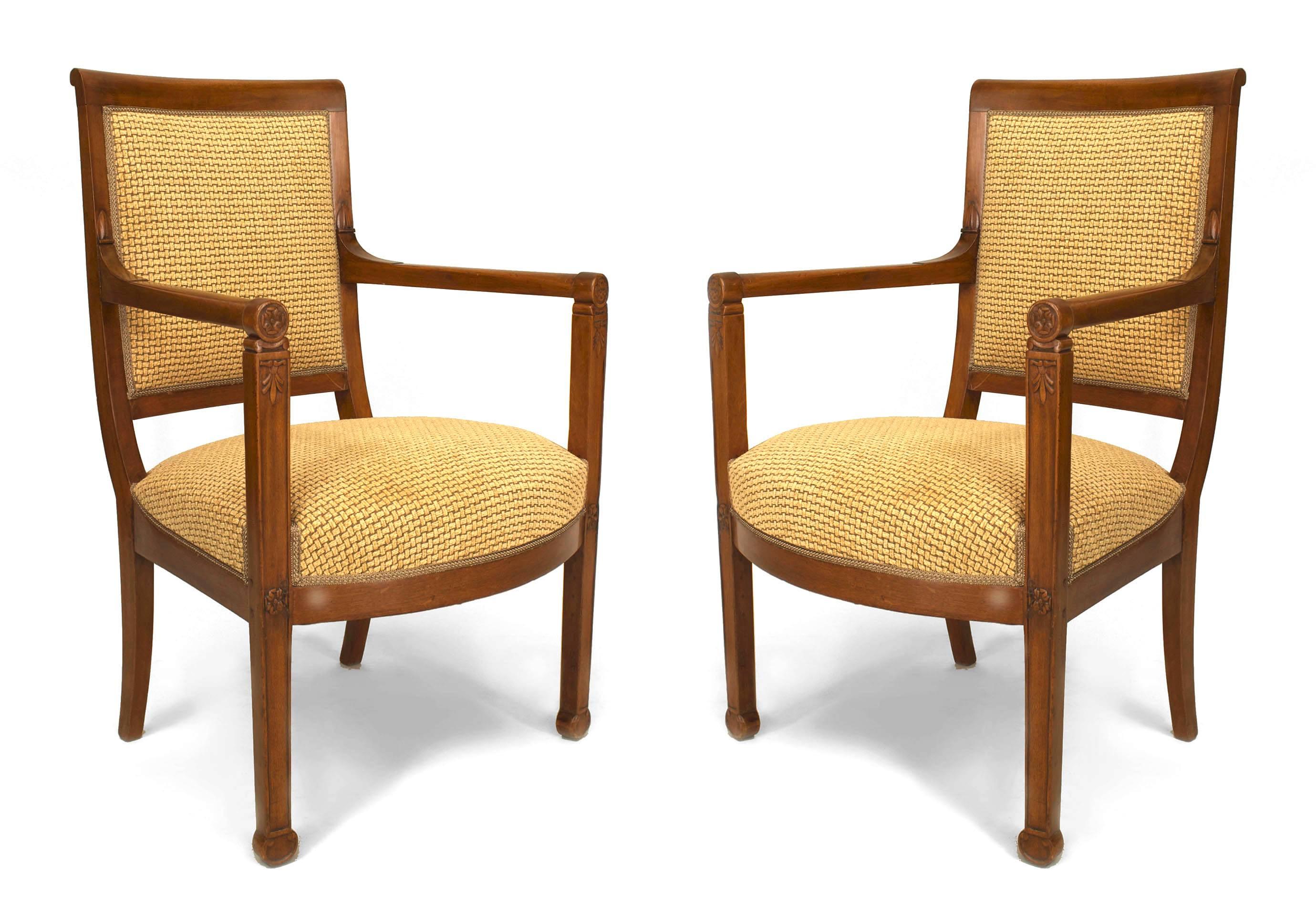 Set of 4 Italian Neo-classic (19th Century) fruitwood open arm chairs with front carving & rounded arms with a woven style gold upholstered seat and back
