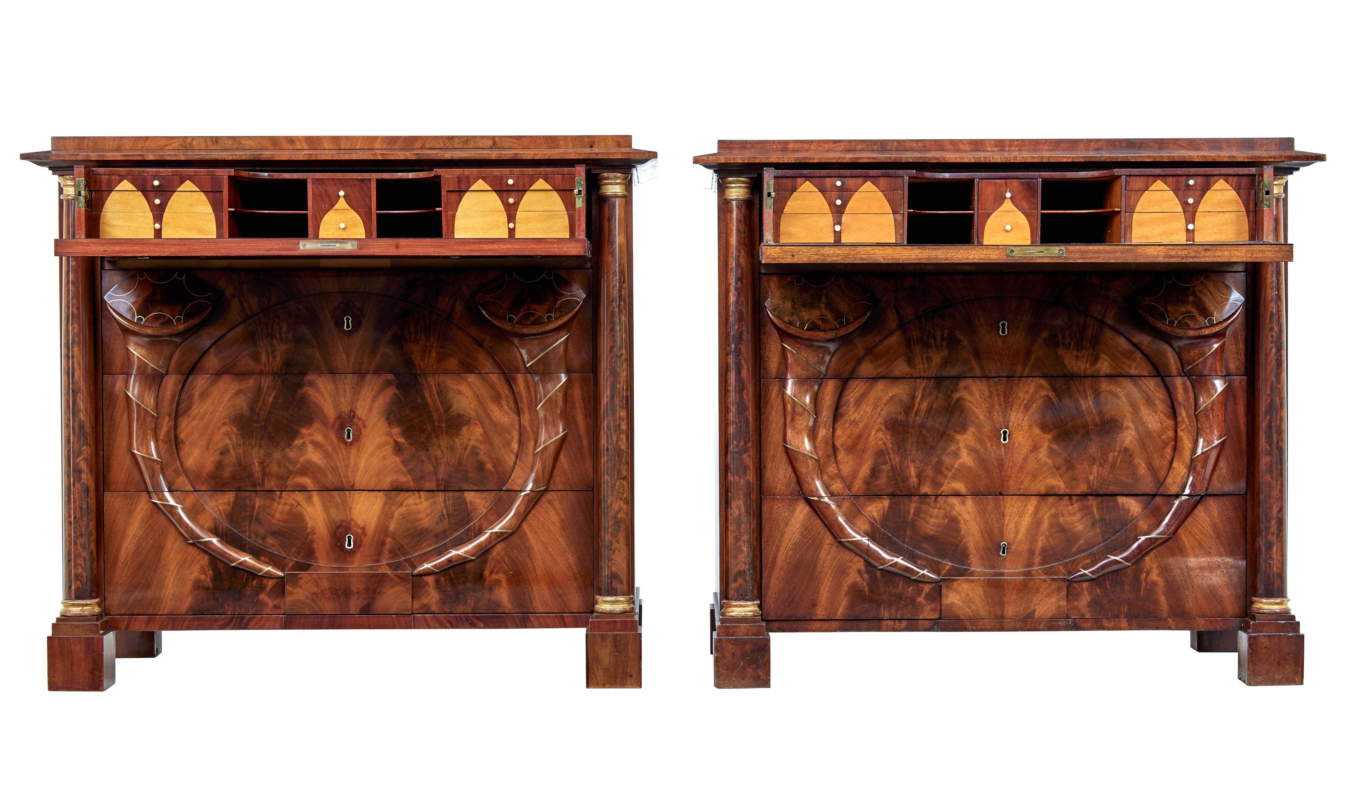 Pair of early 19th century mahogany Biedermeier secretaire commodes circa 1830.

Rare pair of Biedermeier period Swedish chest of drawers.  4 drawers, each top drawer with a fully fitted interior of satinwood and mahogany drawers and pigeon holes. 