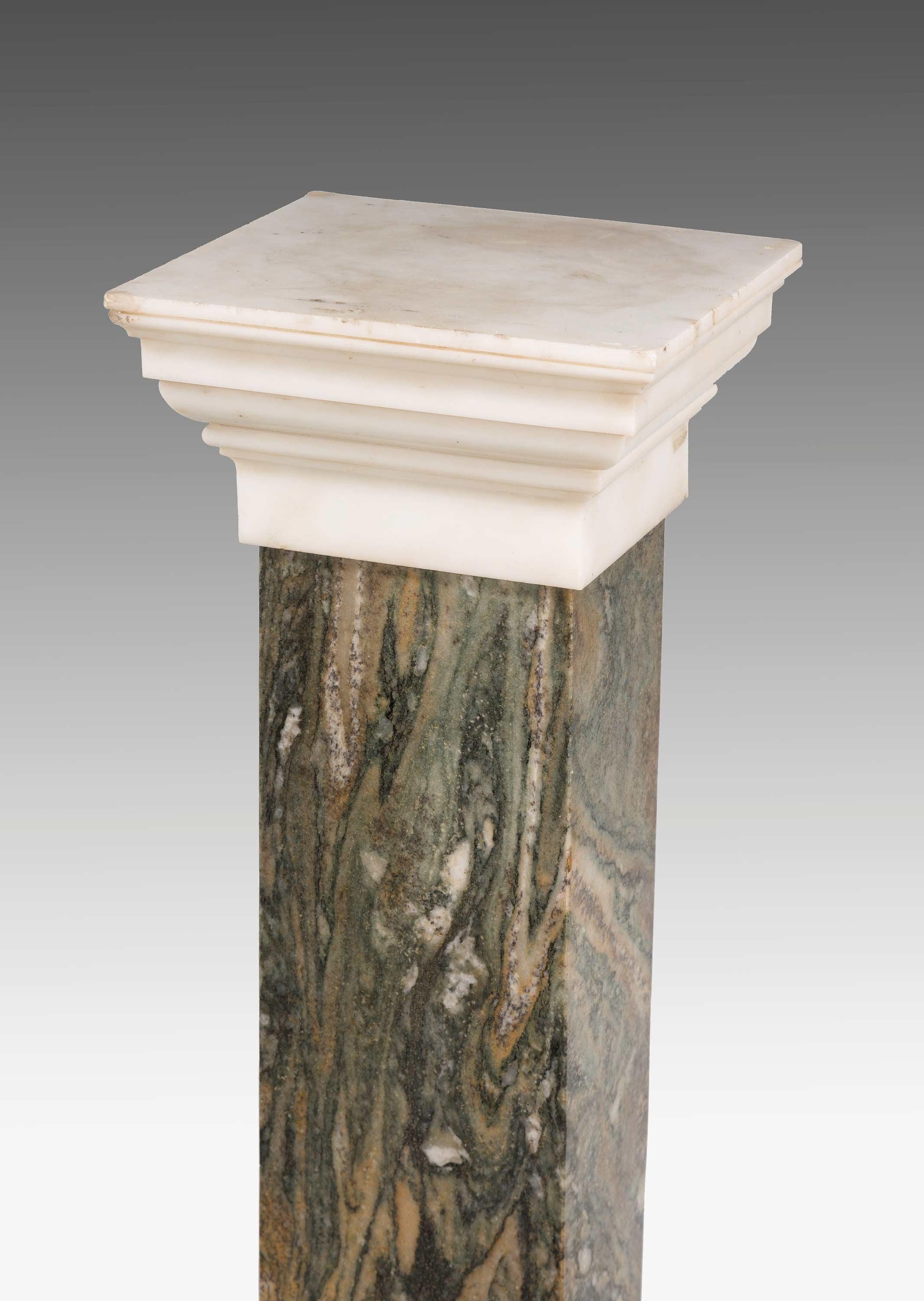A good pair of Italian early 19th century marble columns on stepped bases with shaped matching tops.