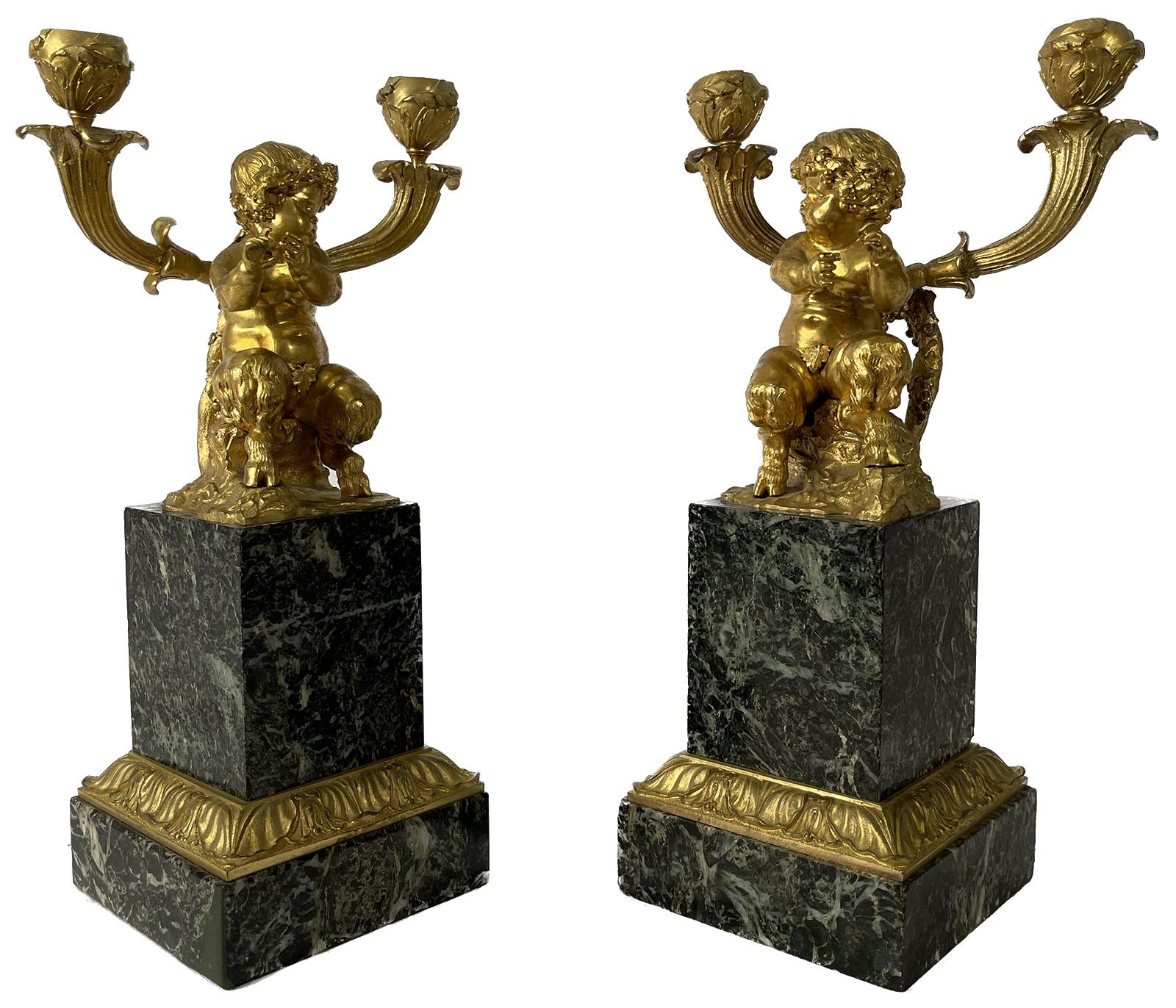 A pair of early 19th century marble and gilt bronze figural candelabras.

Dimensions: 14.25