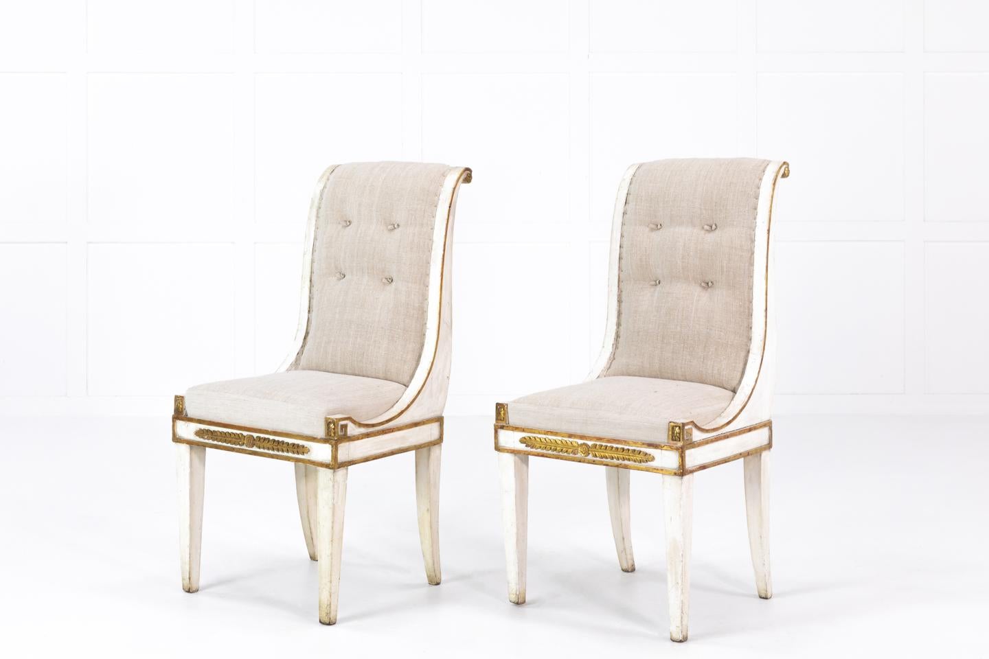 Pair of, stunning, early 19th century Italian side chairs with original gilt and paint. Wonderful design and shape. Upholstered by us in an antique linen.