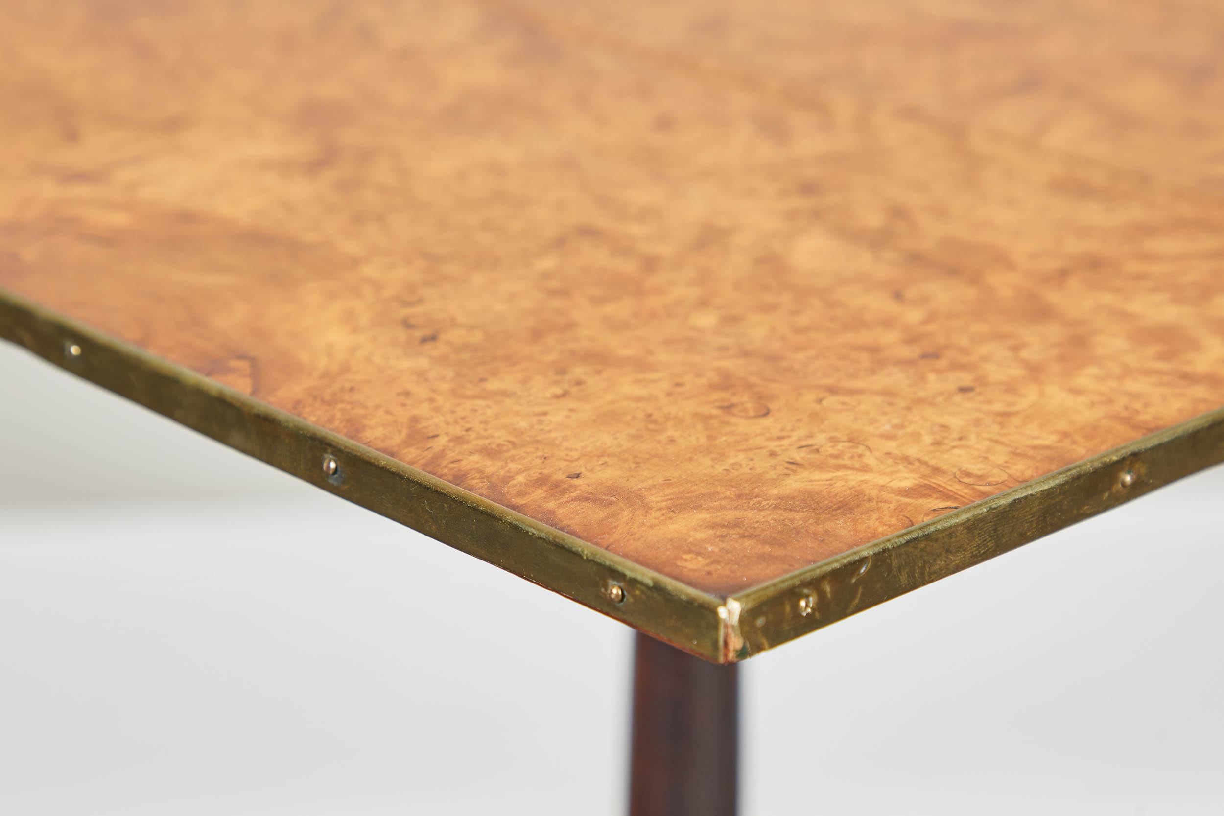 A pair of early 19th century Swedish pedestal tilt-top side tables. Brass trim detailing around table tops. Charming pieces with great functionality. Appears to have birch wood tops.