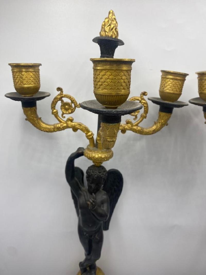 Pair of Early 19th Century Tall French Empire Ormolu & Bronze Candelabras. Depicting angels in patinated bronze, these candelabras are stunning. France, circa 1820s. Measure: 20.5