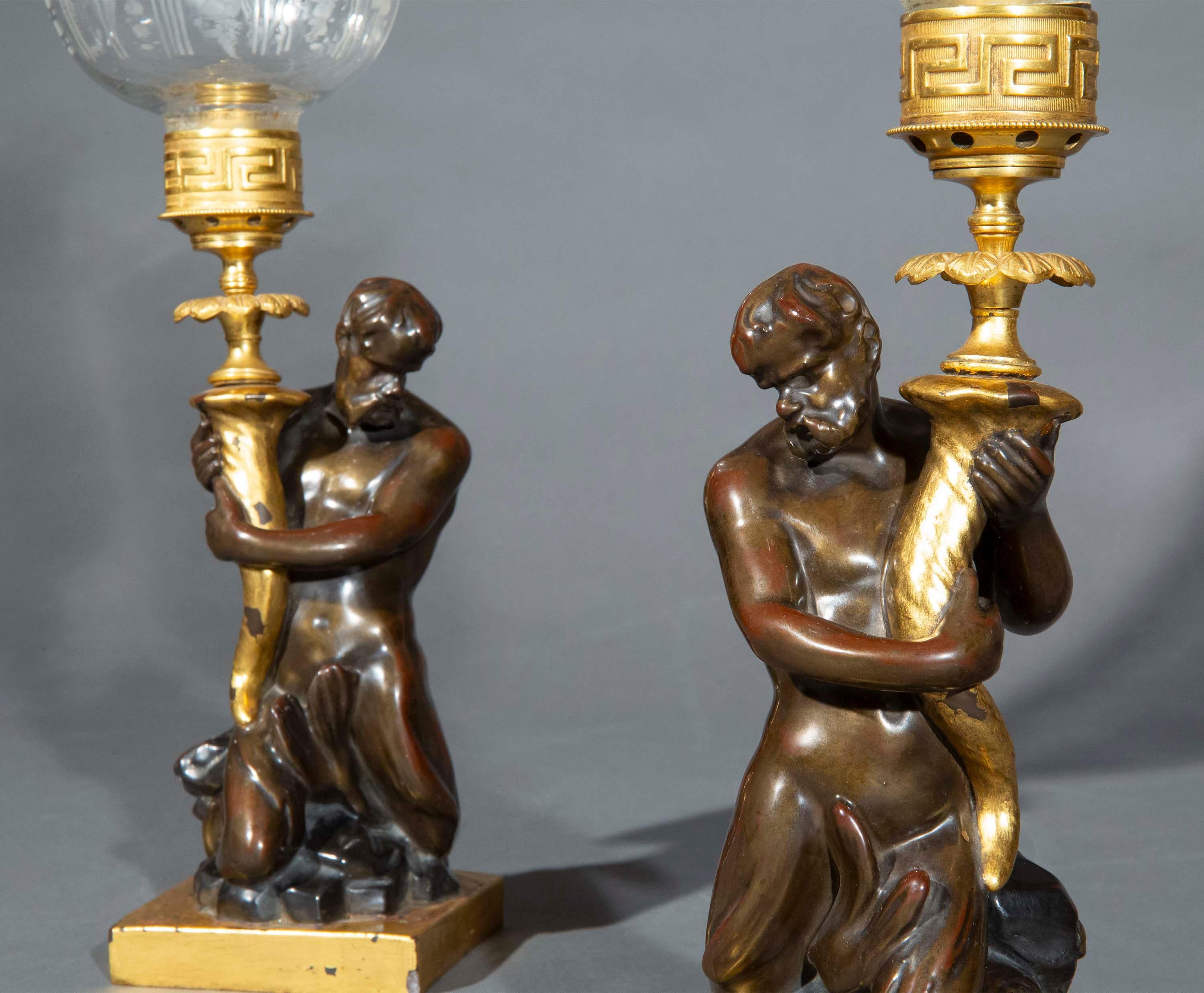 Rare and fabulous pair of Early 19th Century Triton Candlesticks by Wood & Caldwell. English lustre pottery, circa 1815. Now mounted as storm lanterns (also called hurricane lanterns or hurricane lamps). 

Why we like them:

The origin of Tritons