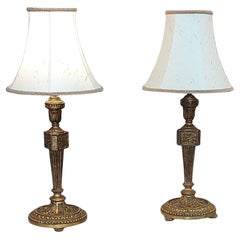 Pareja de candeleros Chateau franceses de madera dorada de principios del siglo XIX